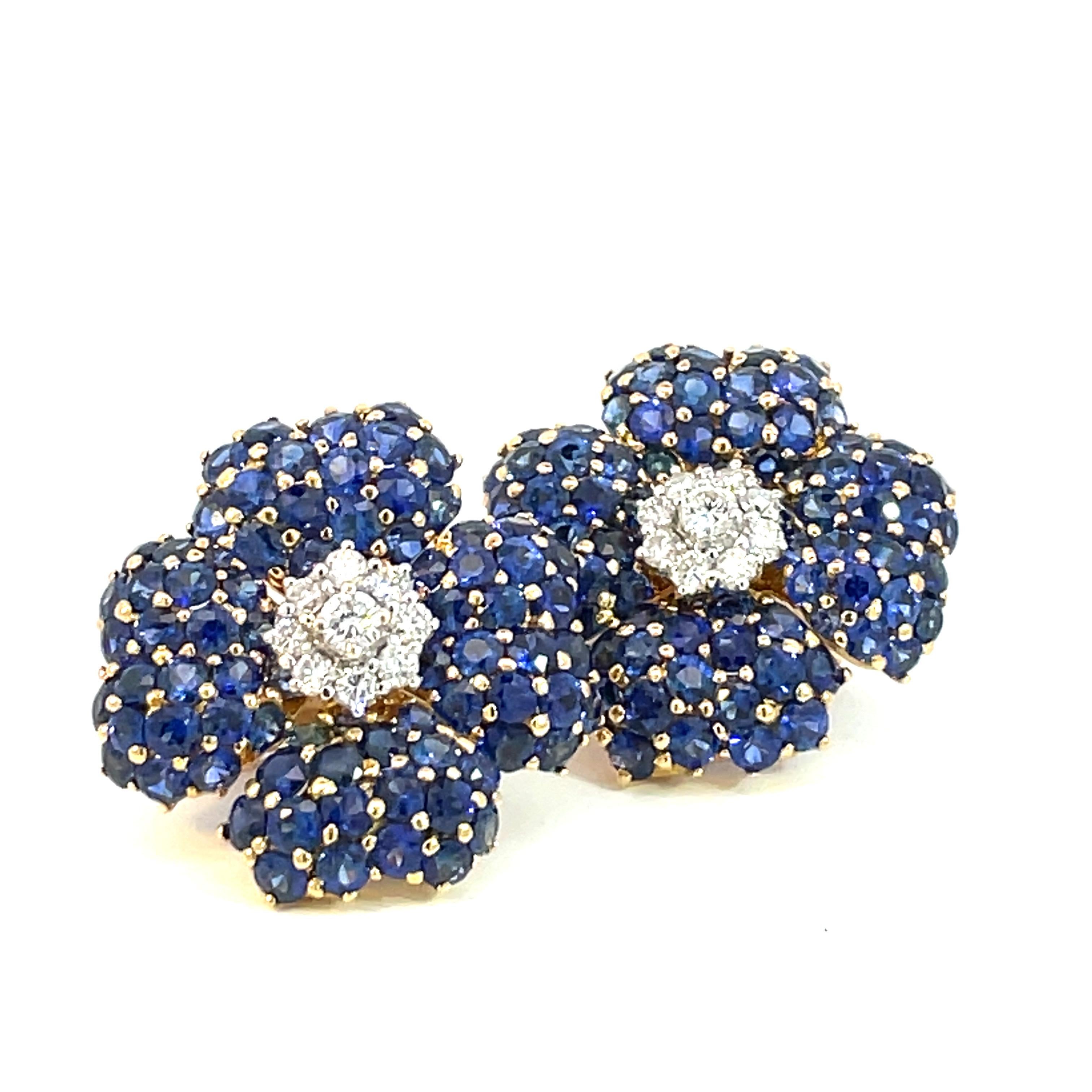 A large pair of natural blue sapphire and natural diamond earrings set in yellow and white gold with a beautiful honeycomb à jour finishing, a collapsable post and an ear-clip system.

18 Brilliant cut natural diamonds weighing 0.95ct total weight,