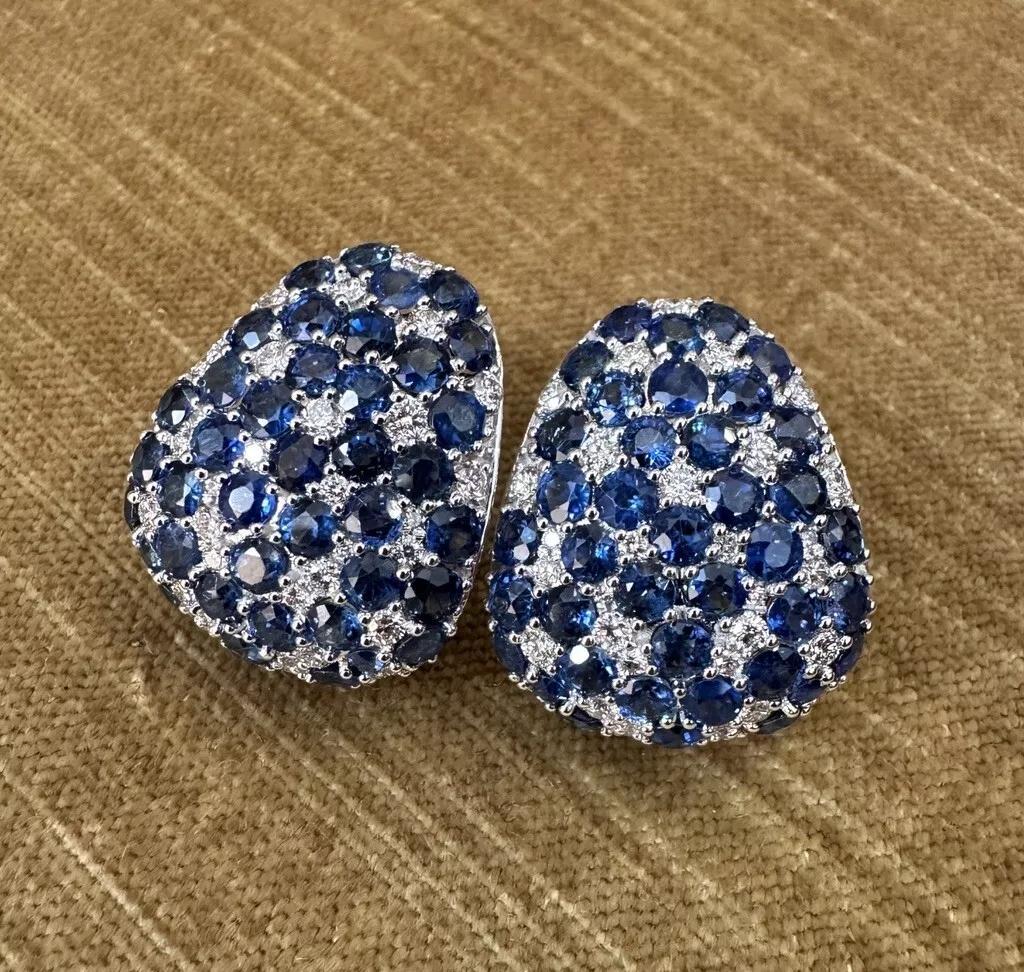 Large Sapphire and Diamond Half-hoop Earrings in 18k White Gold 

Sapphire and Diamond Earrings features 16.22 carats of Natural Round Sapphires pave set with Round Brilliant Diamonds weighing 1.90 carats, all set in 18k White Gold in a Triangular
