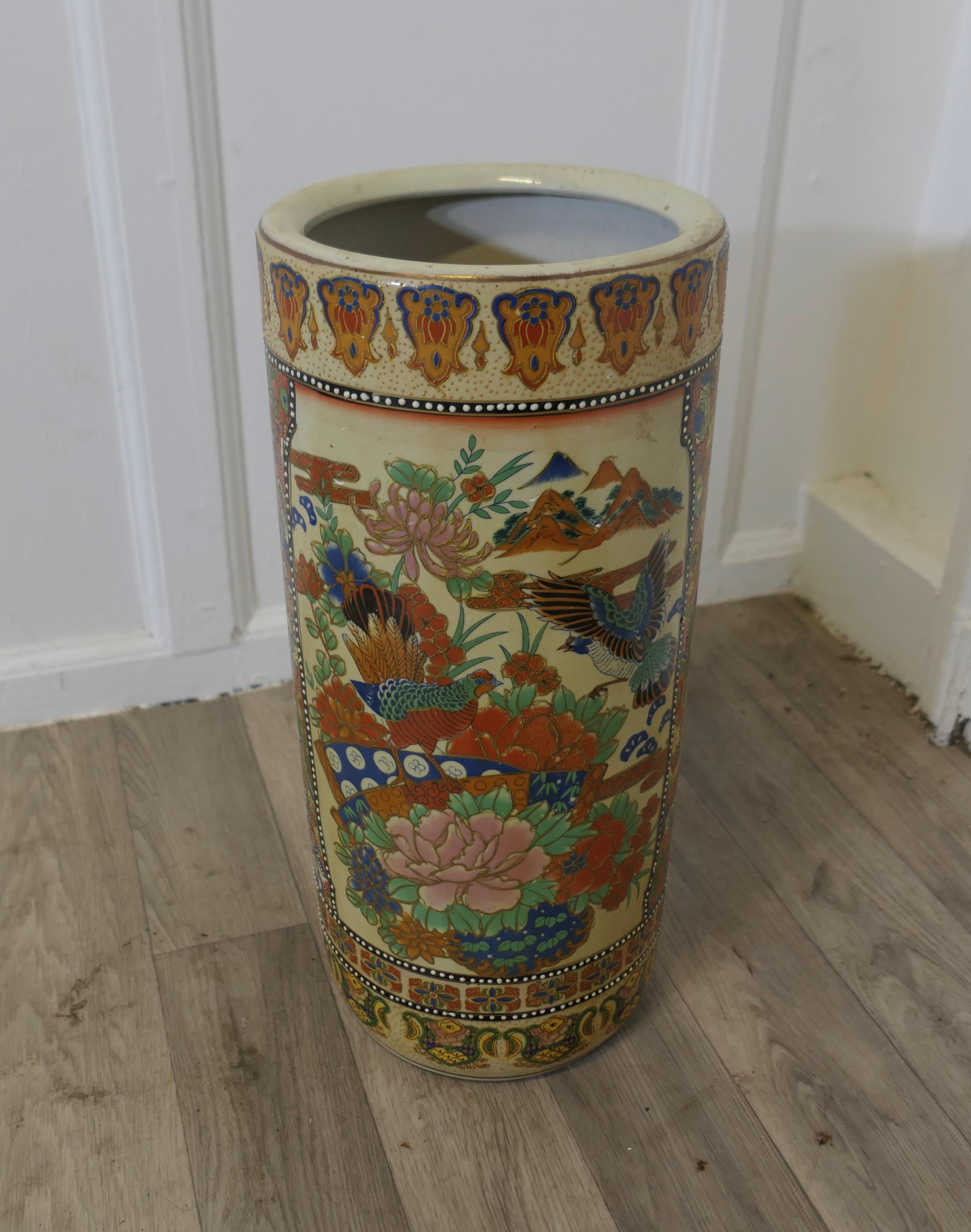 Large Satsuma Floor Vase, Umbrella Stand

This beautiful looking piece is round in shape , hand modelled and painted, the decoration has many Birds and flowers, it is 18” tall and 8” in diameter
TNG252