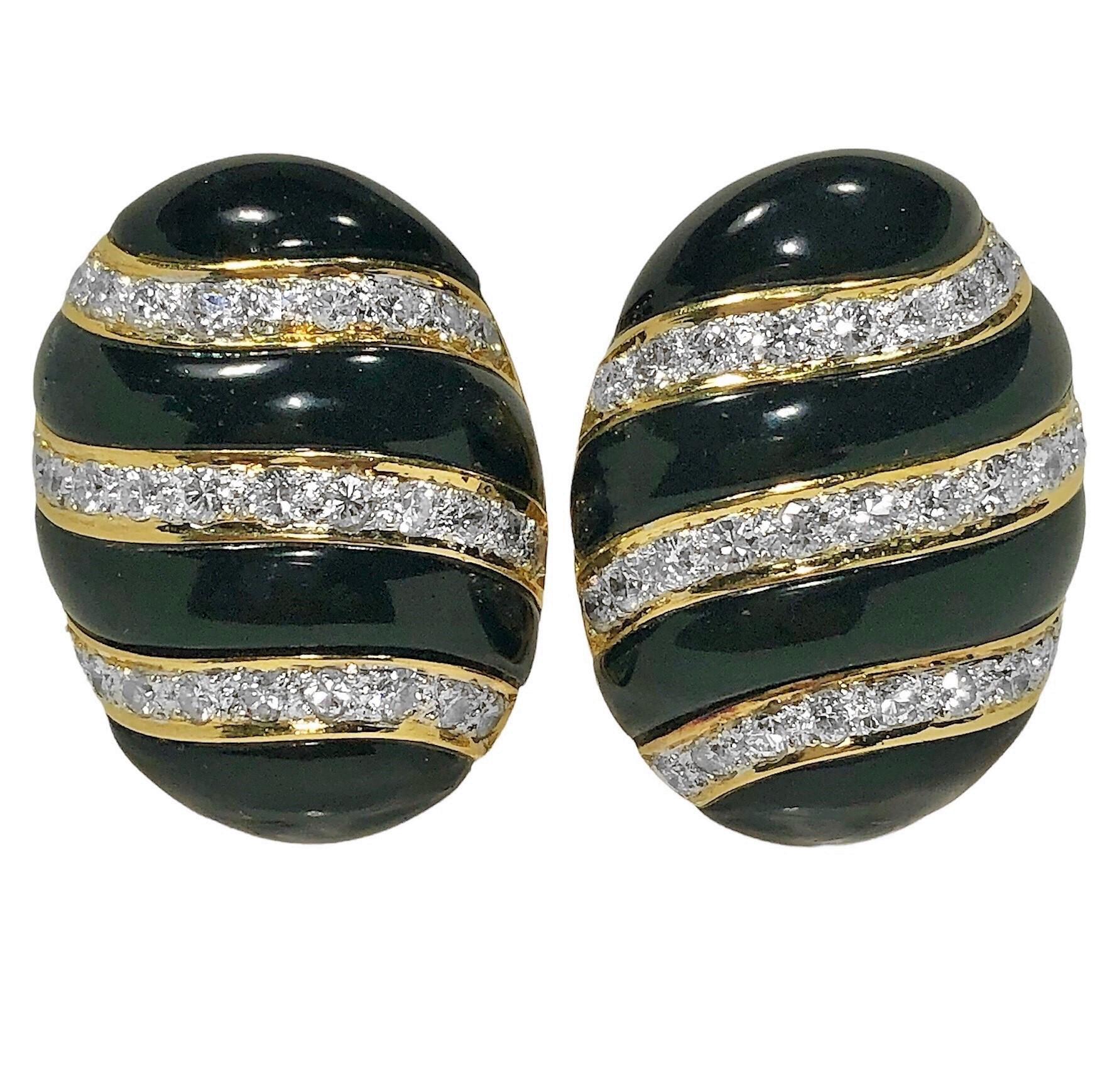This lovely pair of 18k yellow gold, onyx and diamond earrings are crafted to the very highest level of quality. Set with 62 round brilliant cut diamonds having a total approximate weight of 2.00ct. of overall F/G color and VS1 clarity. The
