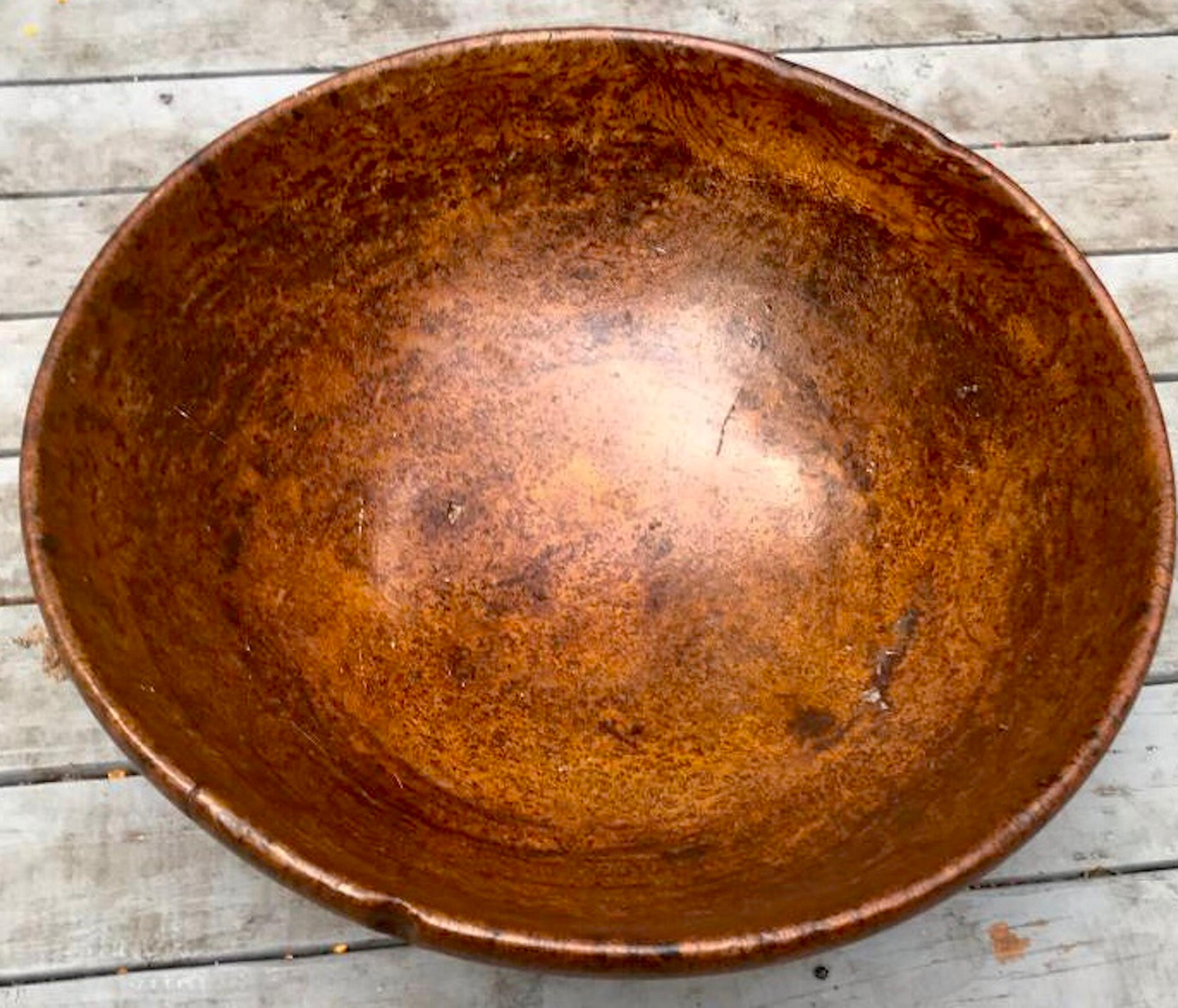Great color and of a large proportion and a beautiful surface and color. In very good condition overall. Either maple or ashwood with shaped rim and foot. Most likely Native American made.