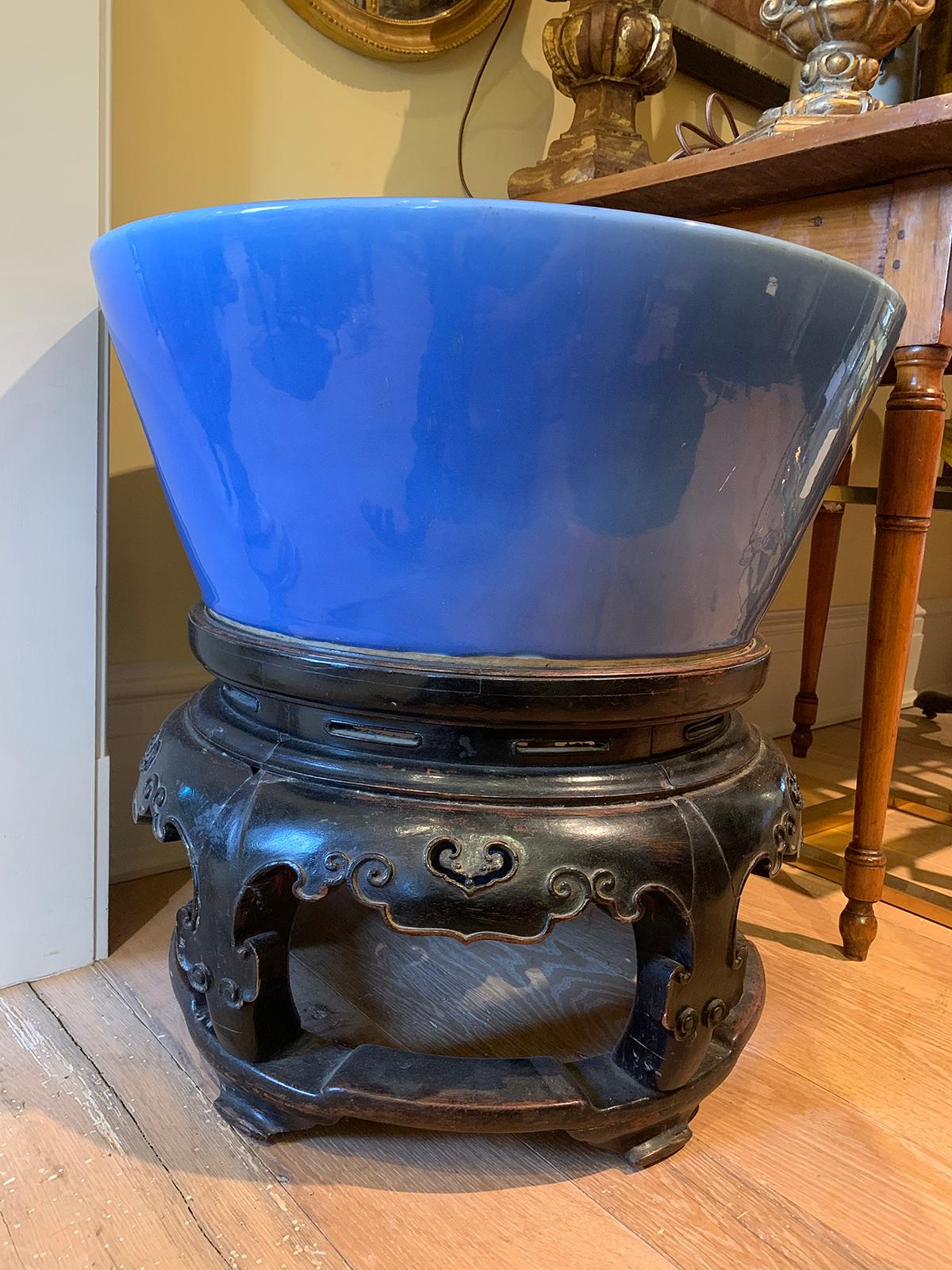 Large scale 19th century Chinese monochrome blue glazed pottery Koi bowl on carved wooden stand.
Bowl measures: 9.75