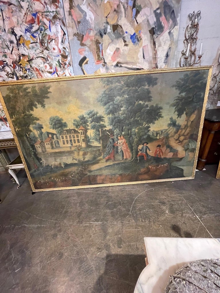 Decorative large scale 19th century French framed oil painting on canvas. Featuring a lovely landscape, including a fine estate and a courting scene. Note: This painting was removed from the Chateau de Montolivet in Passins, France an amazing piece
