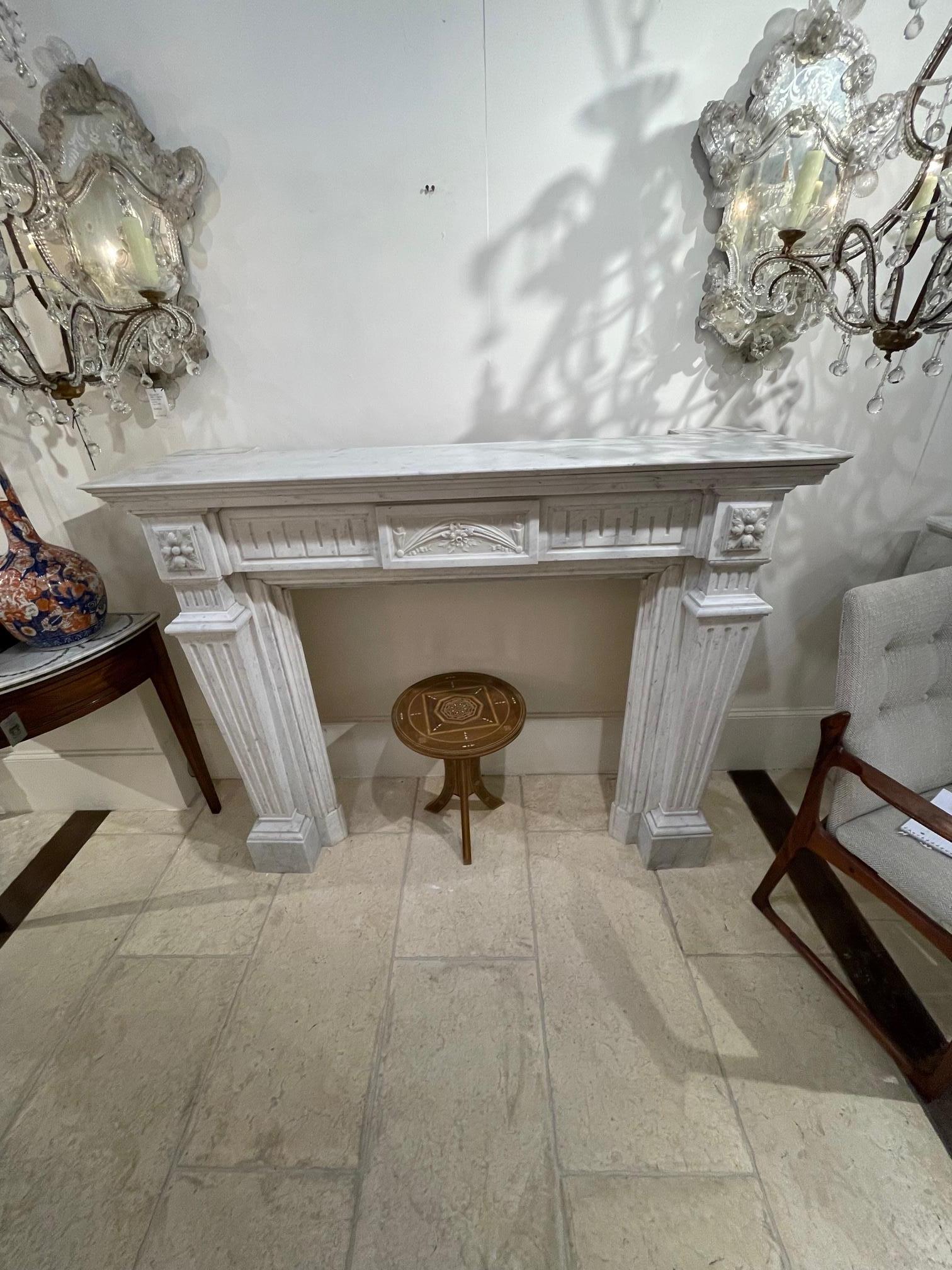 Impressive large scale 19th century French Louis XVI style carrara marble mantel. Beautiful decorative pattern including Greek key pattern and flowers. A truly exceptional piece that would be a real focal point in a fine home!
Note: The breast pate