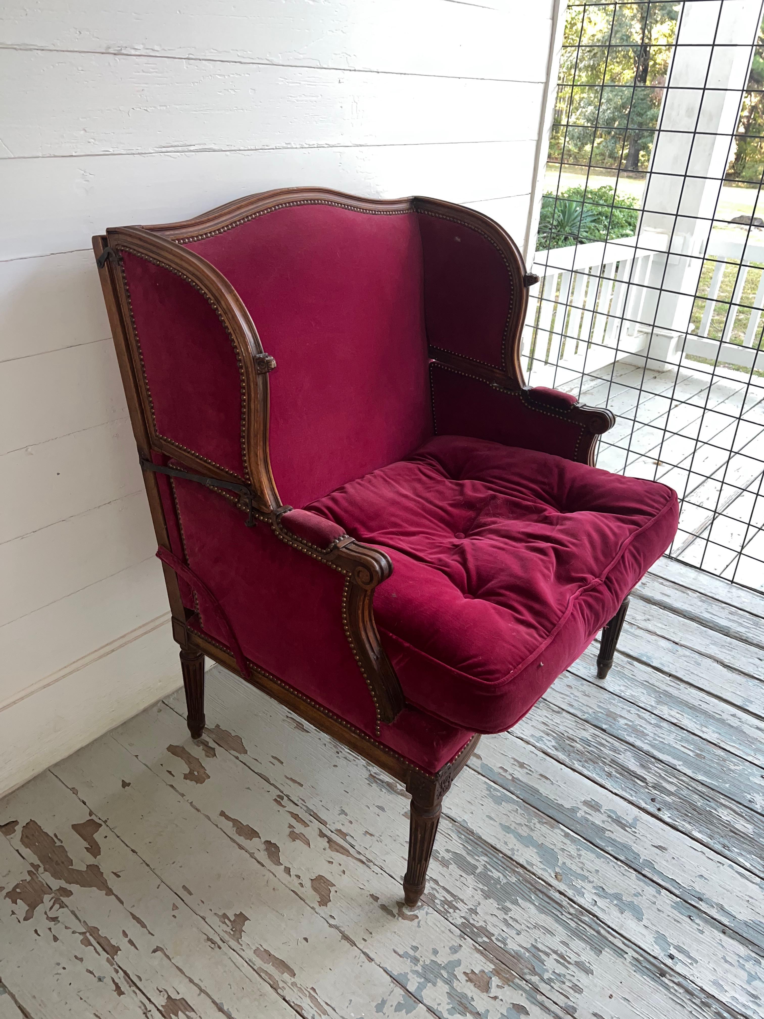 A french 19th century carved walnut metamorphic bergere, armchair that easily folds out to a bed. This highly decorative chair is wonderful to look at, large enough for a tall person to use comfortably and is very pratical for extra sleeping on a