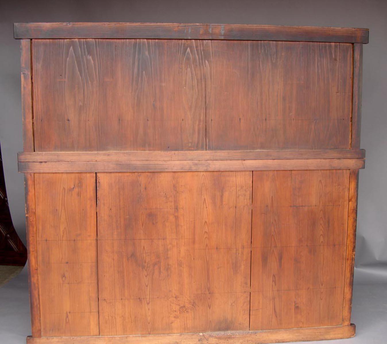 Hinoki wood shop cabinet with sliding doors, multiple drawers and doors, circa 1850s. Bamboo nails and original hardware. This cabinet consists of two pieces. Beautiful rich honey colored patina. All door and drawers function smoothly. In very good