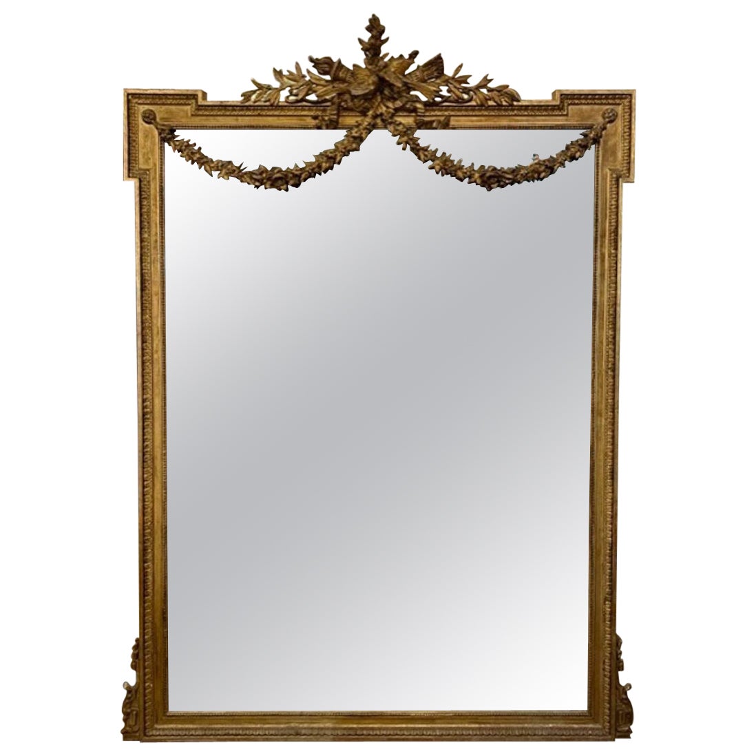 Grand miroir de sol Louis XVI du 19ème siècle en bois sculpté et doré