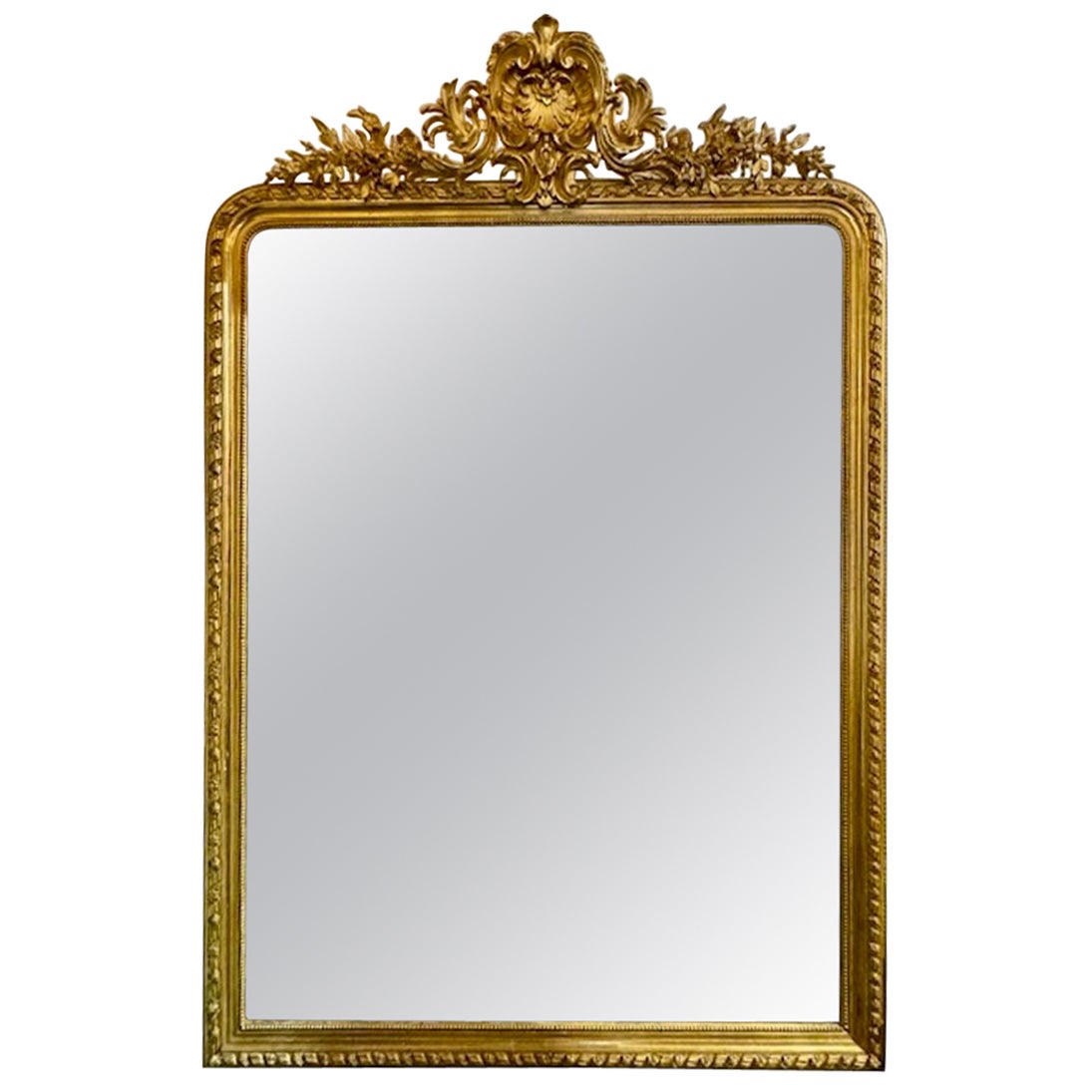 Grand miroir Louis XVI du 19ème siècle sculpté et doré