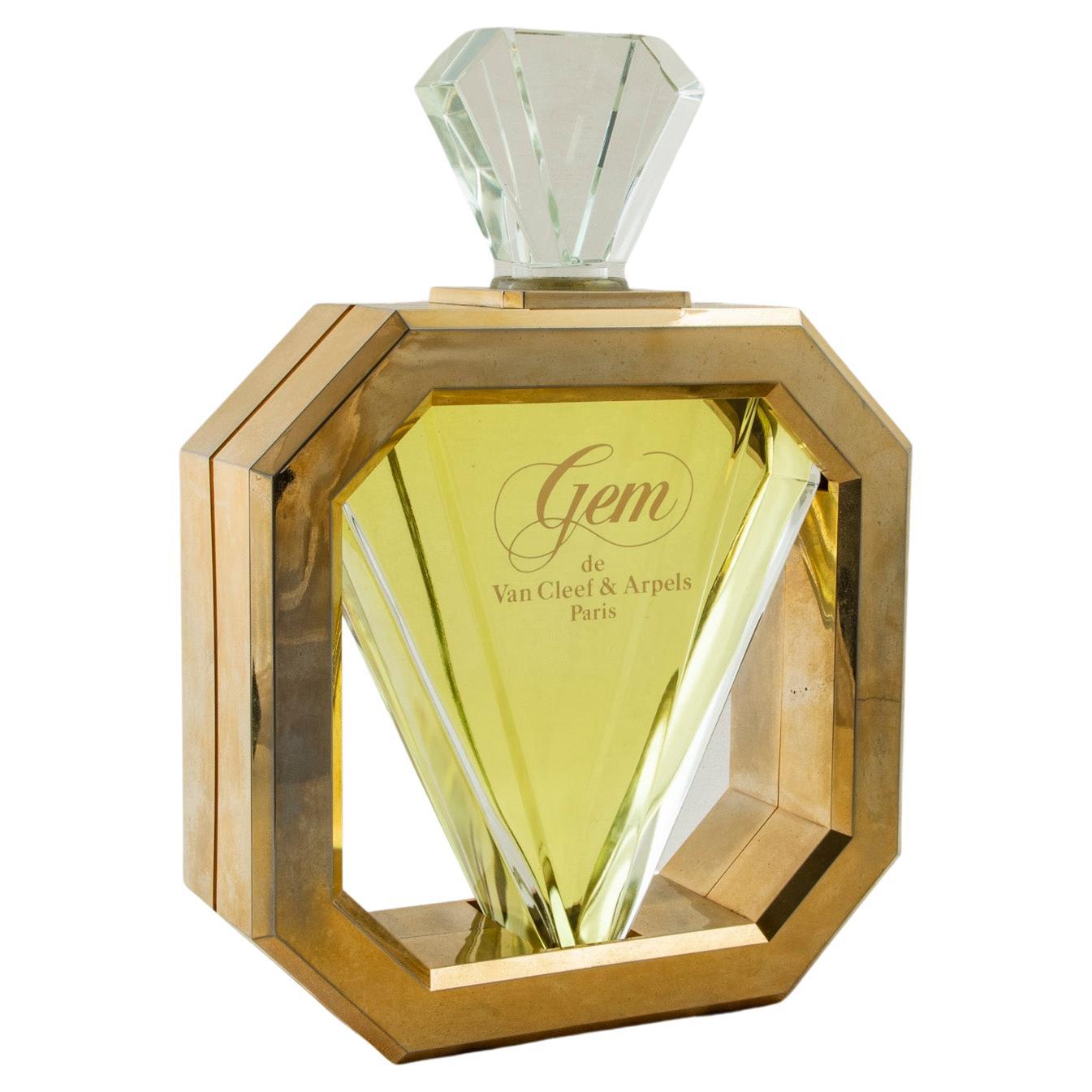 Standing at 13.25 inches in height, this large scale glass perfume factice is marked Gem de Van Cleef & Arpels, Paris. Originally used in a French perfume shop for window display when the perfume made its debut in 1987, this factice has an octagonal