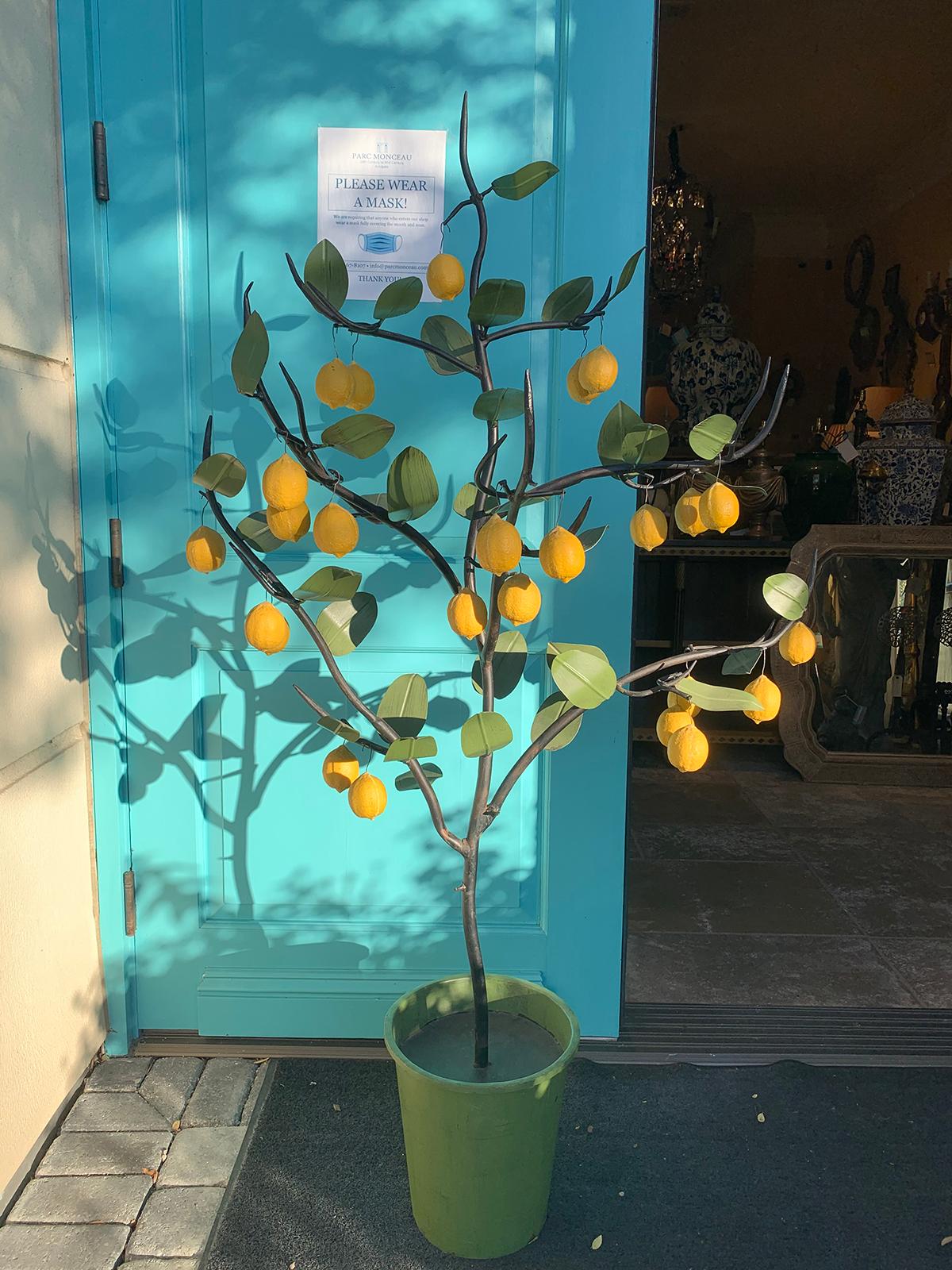 Large scale 20th century Italian tole lemon tree.
Lemons are removable, they hang on hooks
Measures: Overall 35