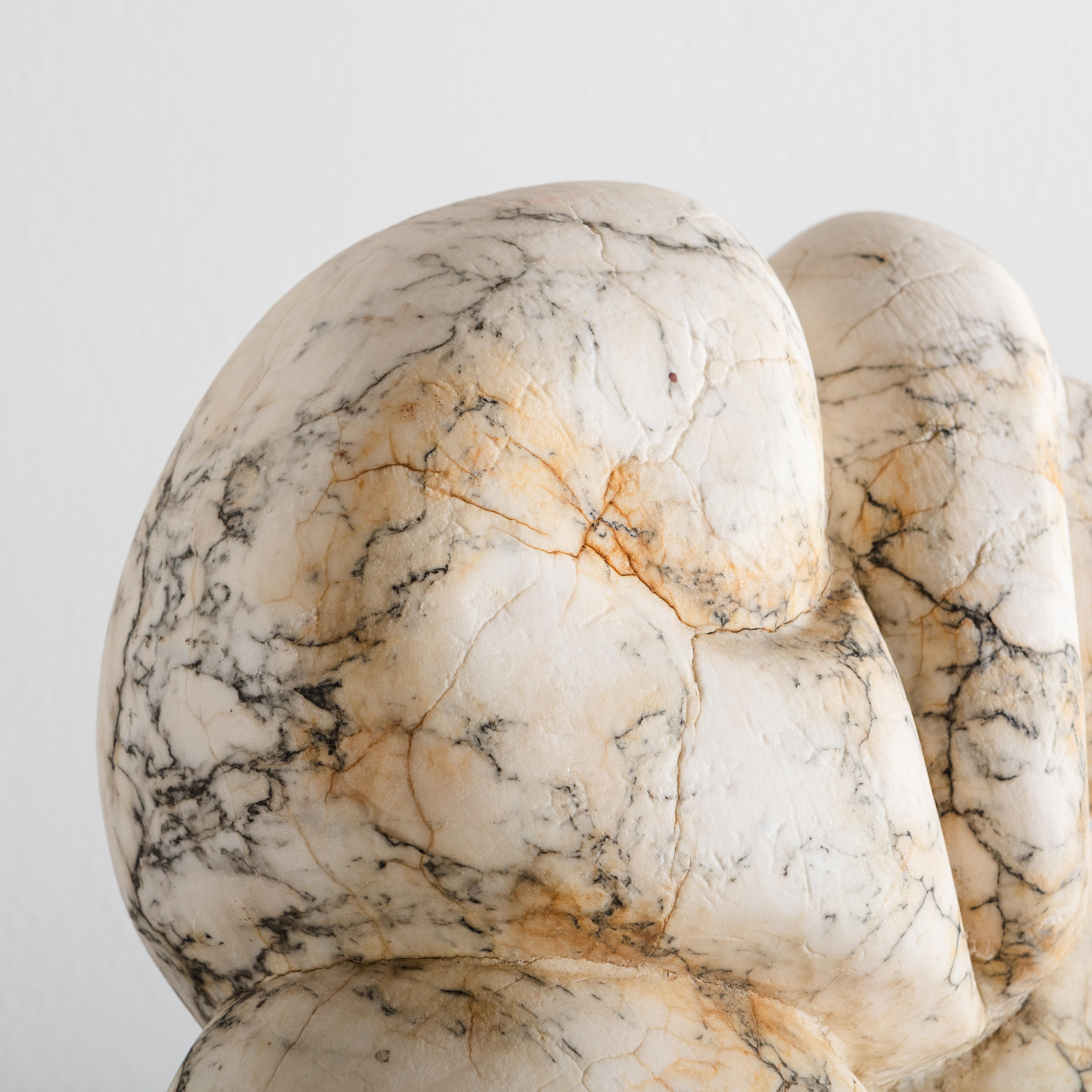 A stunning hand carved marble sculpture with dramatic veining; an eye catching large scale and undeniable gravitas. This abstract sculpture is not signed but it came from the private estate of an Italian importer in Michigan. This would be a