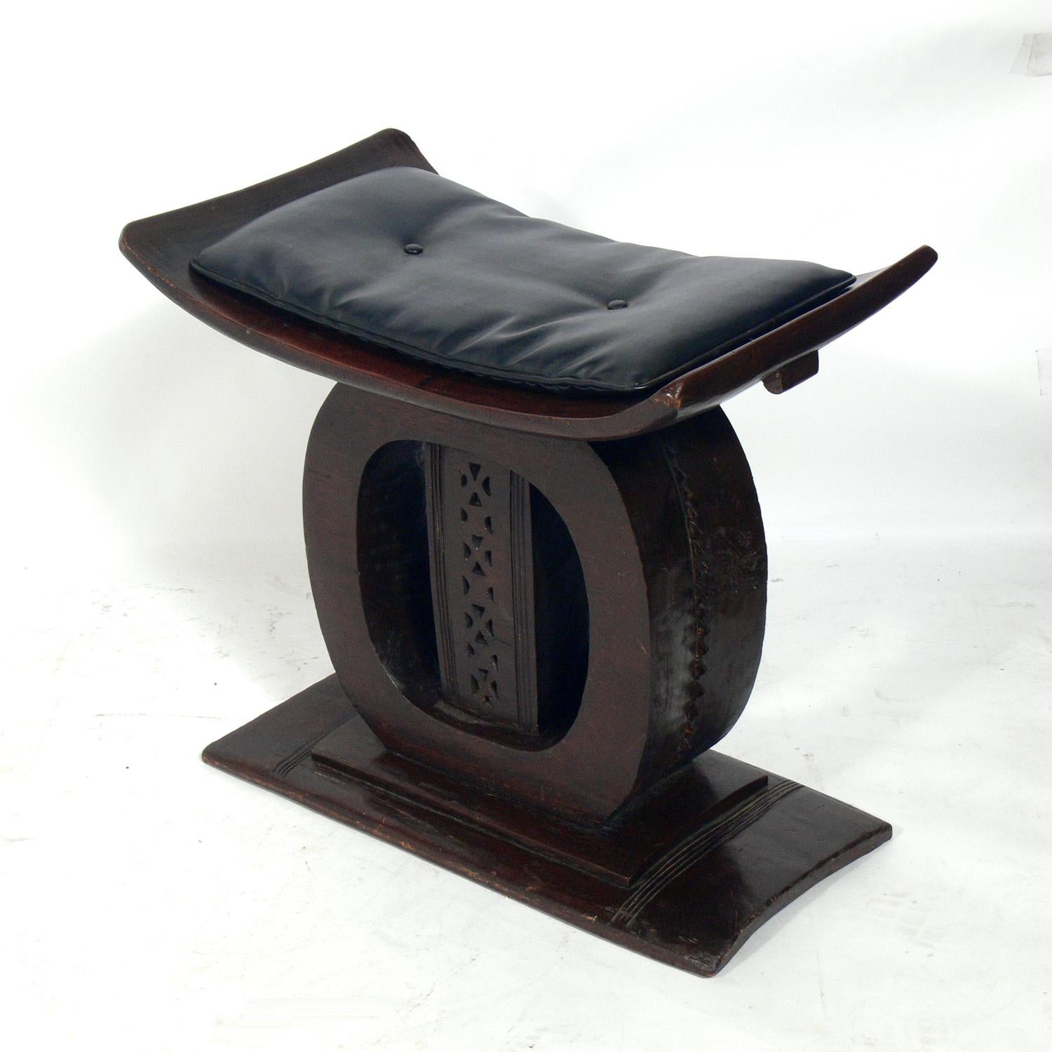 Large scale African wood stool, hand carved by an Asante or Ashanti artist, Ghana, at least circa 1950s, possibly much earlier. This came from the estate of Mr. and Mrs. Alan Goldberg of Atlanta, GA. They were world travelers from the 1930s-1980s,