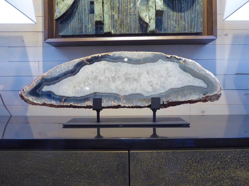 A large scale, beautiful agate specimen on a heavy custom wrought iron stand. The dimensions given in the listing include the stand.