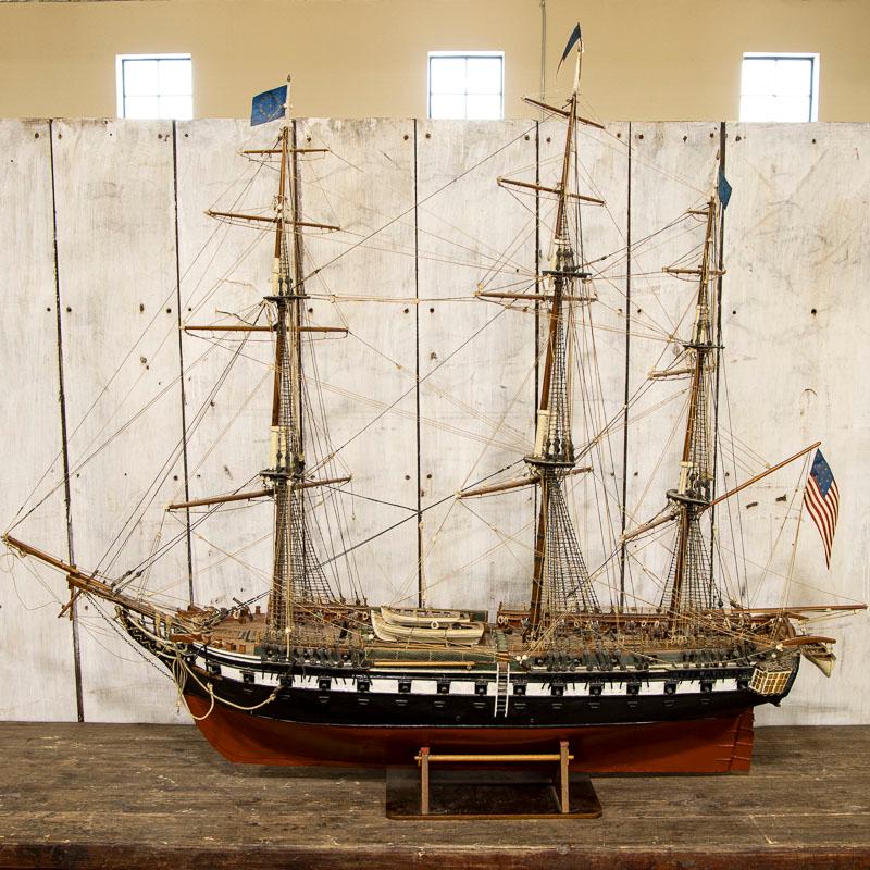 This exceptionally large-scale wooden model ship represents the USS Constitution or 