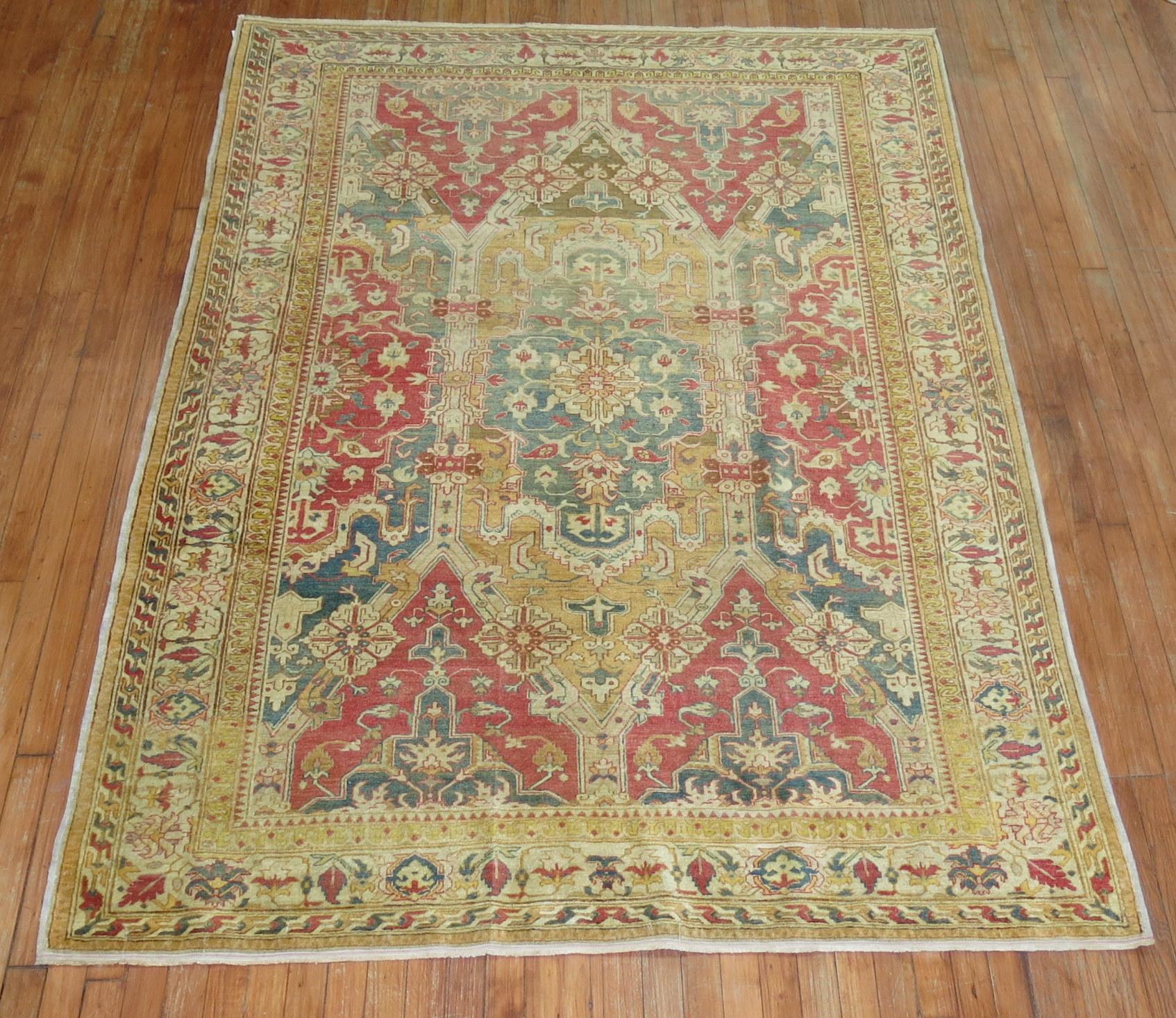 A very finely hand-knotted truly divine formal Turkish Sivas rug from the early 20th century with a large-scale masculine design in gold, green and pinky red accent colors. Very unusual design and border.

Measures: 5'6'' x 7'6''.
