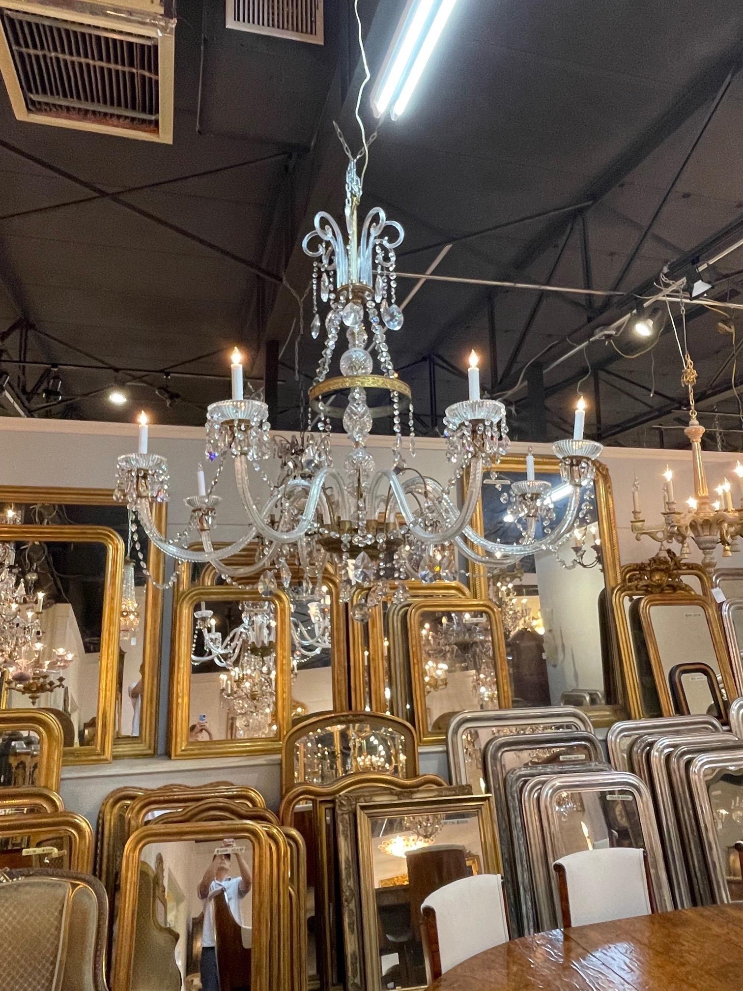 Impressive large scale antique Waterford crystal chandelier. Beautiful glass arms and base along with gorgeous crystals and pretty bronze details. A sparkling beauty!!