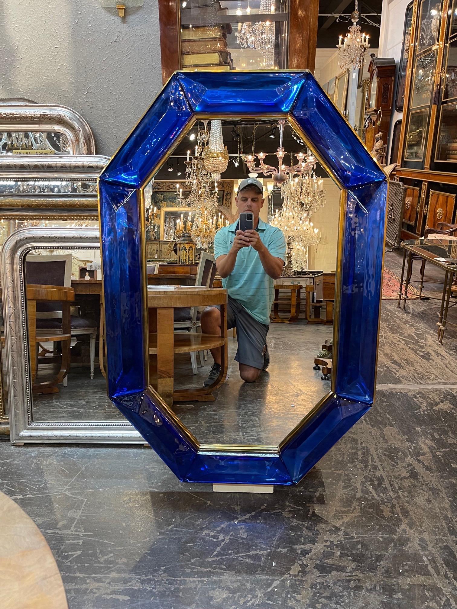 Impressive large scale blue Murano glass and brass mirror. Creates a beautiful decorative look!
