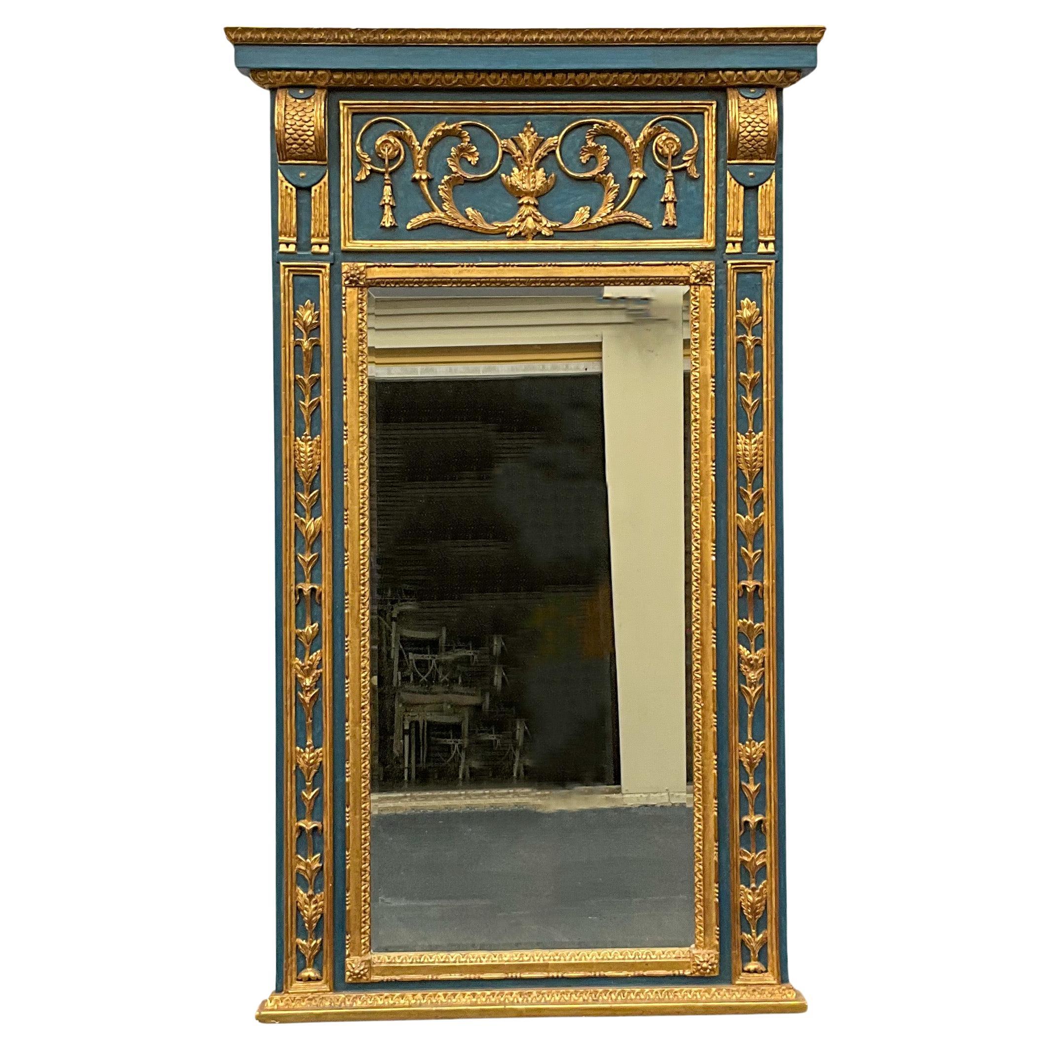This is a large scale Italian blue painted and carved giltwood trumeau style mirror.  The coloration is vivid and wonderful. It is unmarked and in very good condition.