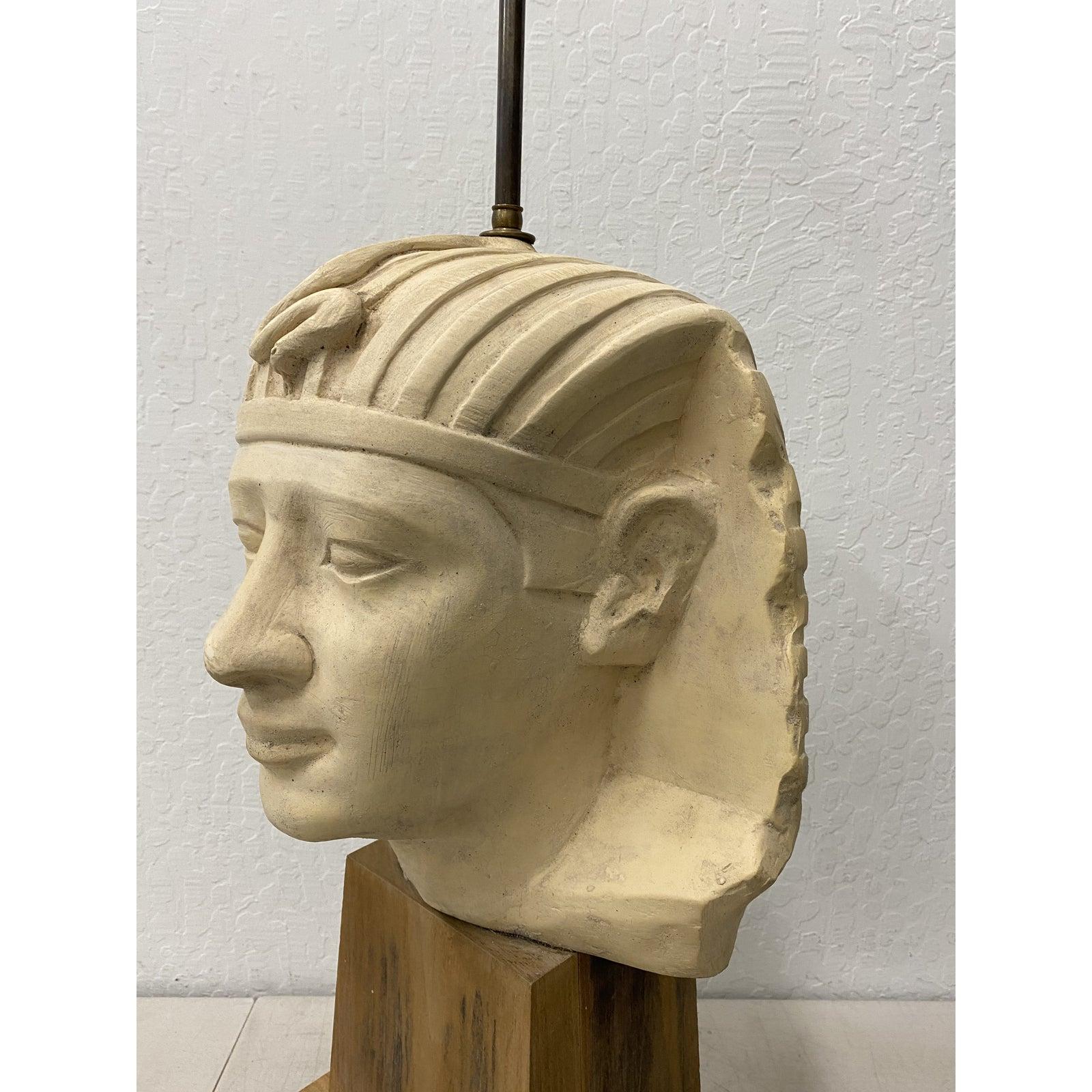 Large scale carved and molded clay Egyptian Pharoah head table lamp, circa 1970

The large head of an Egyptian Pharoah sits atop a custom teak wood pedestal base.

Measures: 11