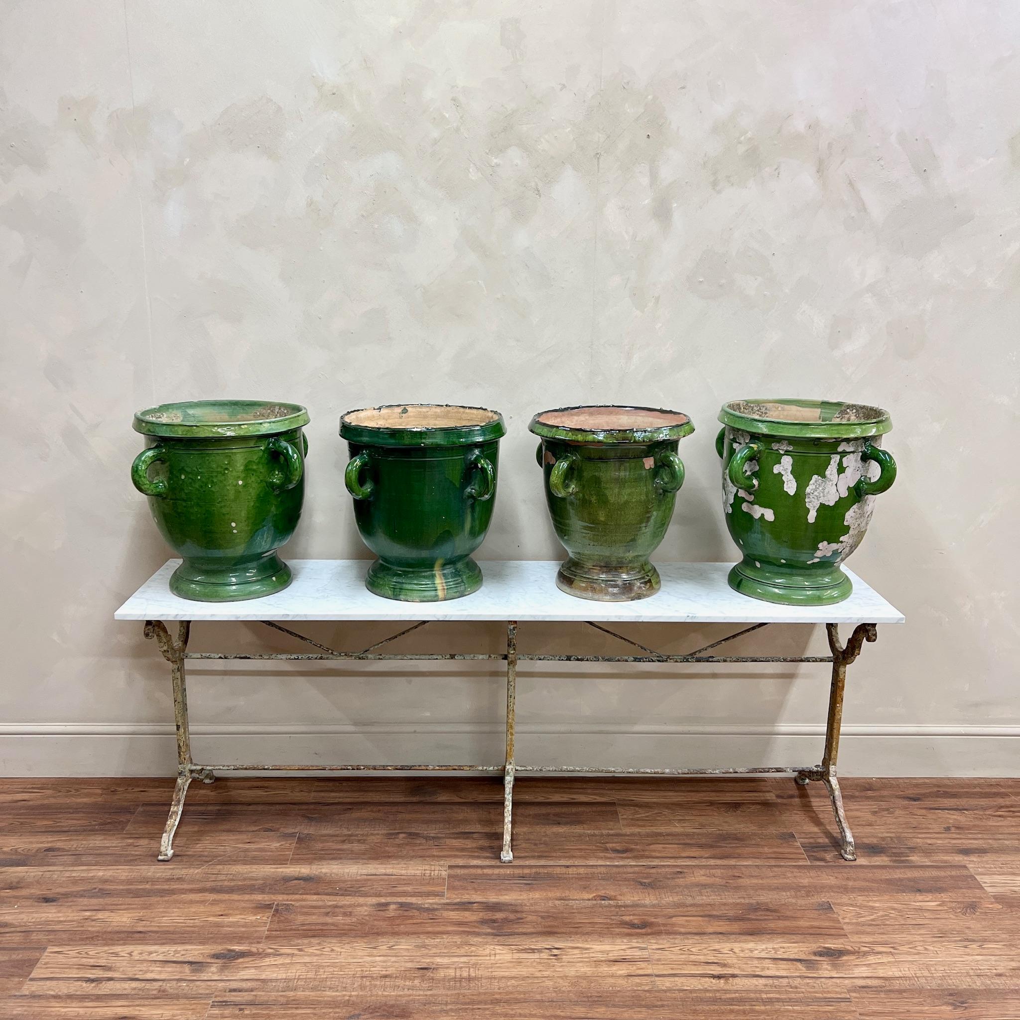 Run of four, larger scale Castelnaudary Pots, with iconic green glaze.
All with four loop handles and drain hole.
No cracks or major damage, just glaze wear, commensurate with age.
Originally created in the 16th century by potters inspired by the
