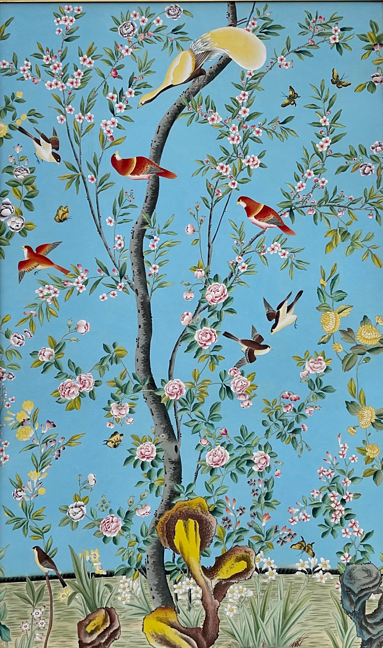20th century chinoiserie style hand painted watercolor on paper in stunning colors to add elegance to any room.  Painting depicts exotic birds perched on branches of a flowering tree all against a bright azure-like blue background. Painting is