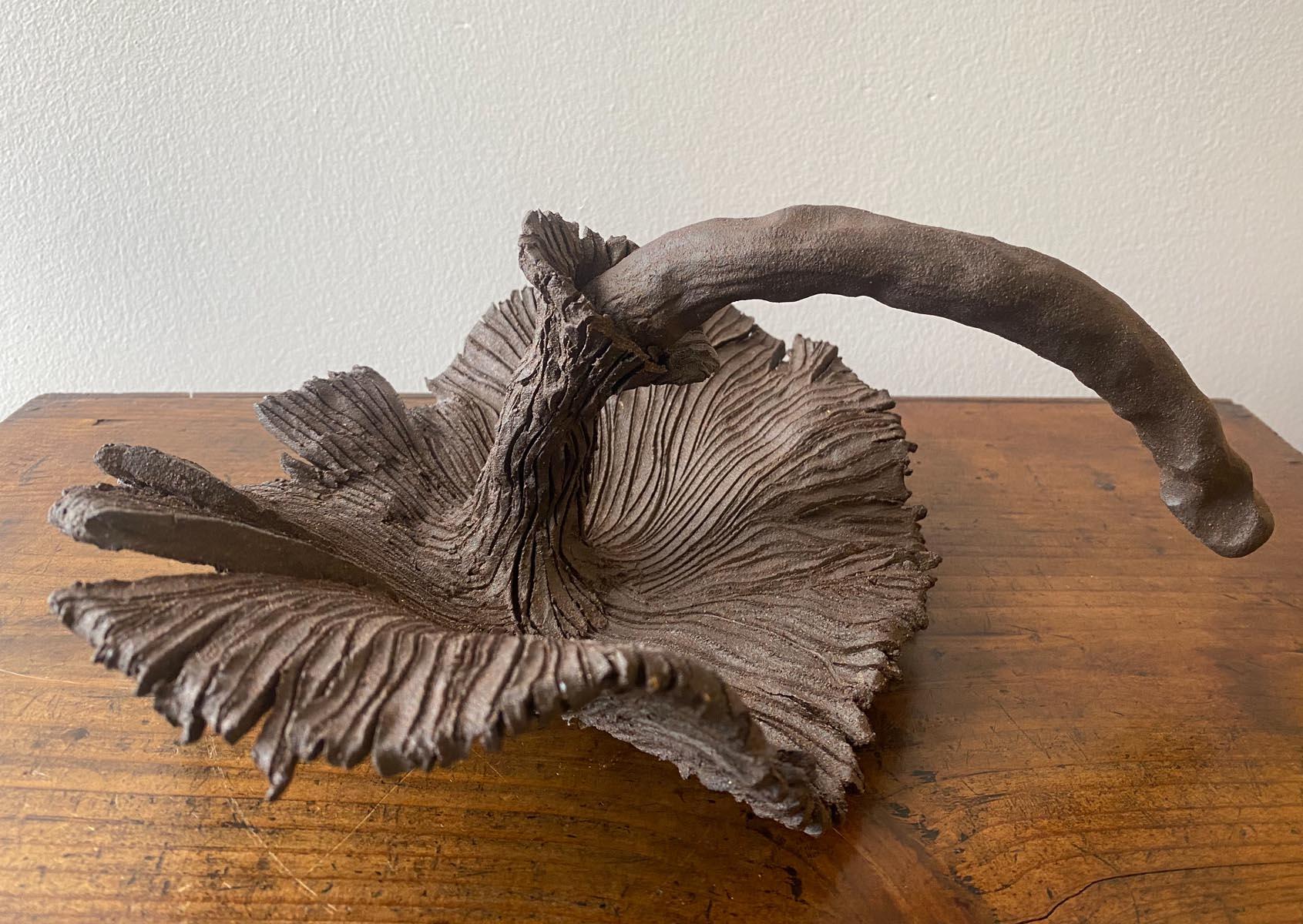 Hand built clay large scale mushroom by ceramic artist Sally Terrell of Santa Barbara, California. Dark, high fired clay, unglazed. Interesting shapes! Perfect conversational piece for a console or coffee table.