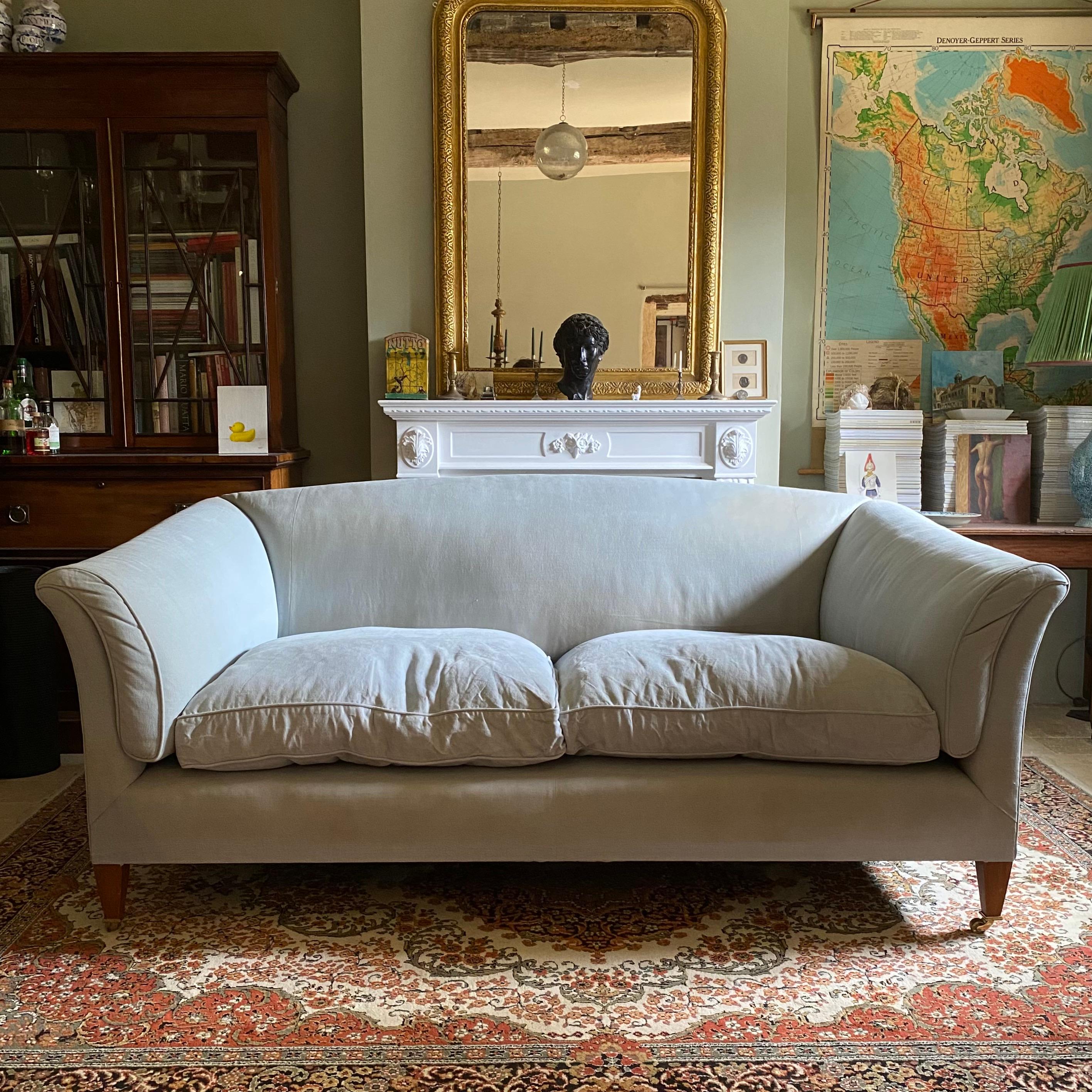 A fantastic huge scale Country House sofa - possibly an Abbey or Priory by Robert Kime. 

The sofa has been bespoke made with a beech frame and exposed legs that terminate in brass castors. It's been upholstered using Pret a Vivre fabric. The