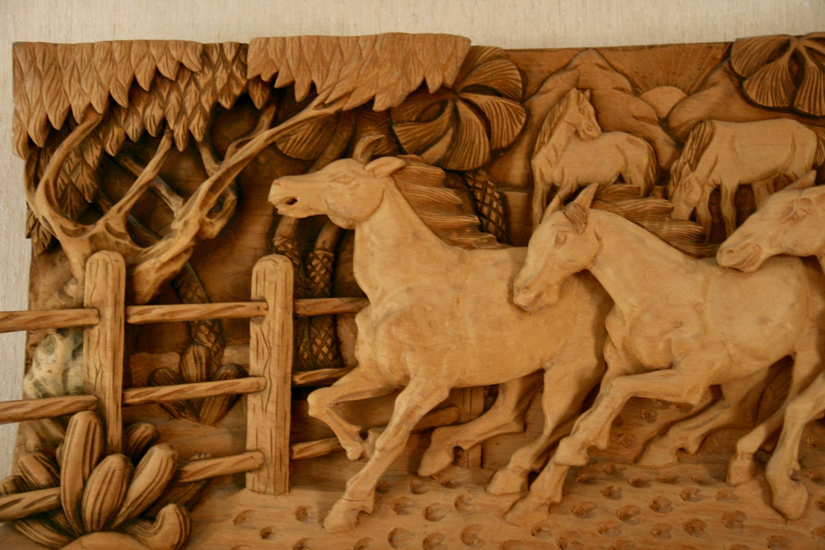 Large-scale Western wood sculpture. A large wood sculpture of horses on a  Western ranch, signed lower right by Dede 88.