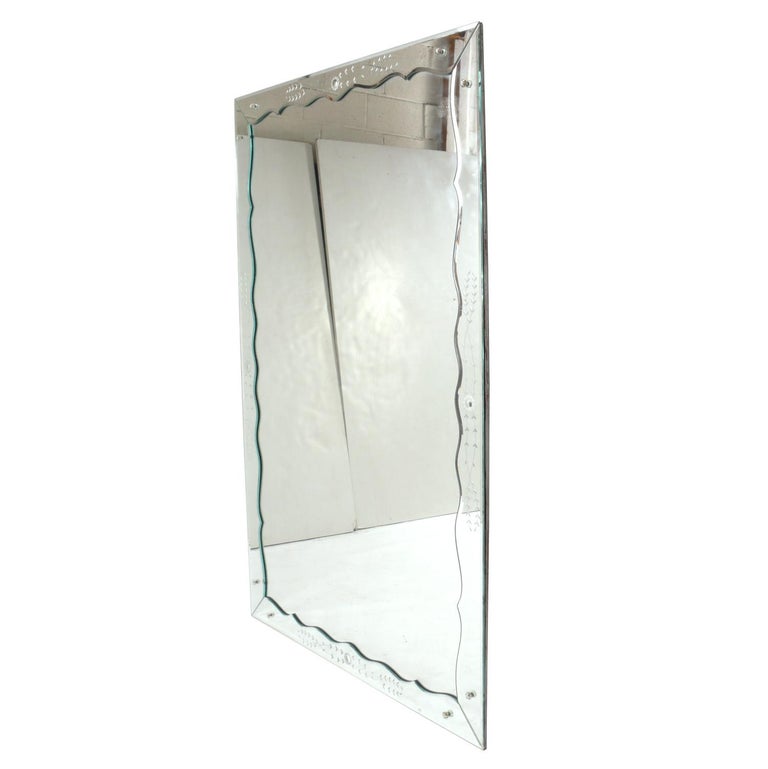 Large scale etched mirror framed mirror, American, circa 1940s. It measures an impressive 6 feet height x 4 feet width. Retains warm original patina.
