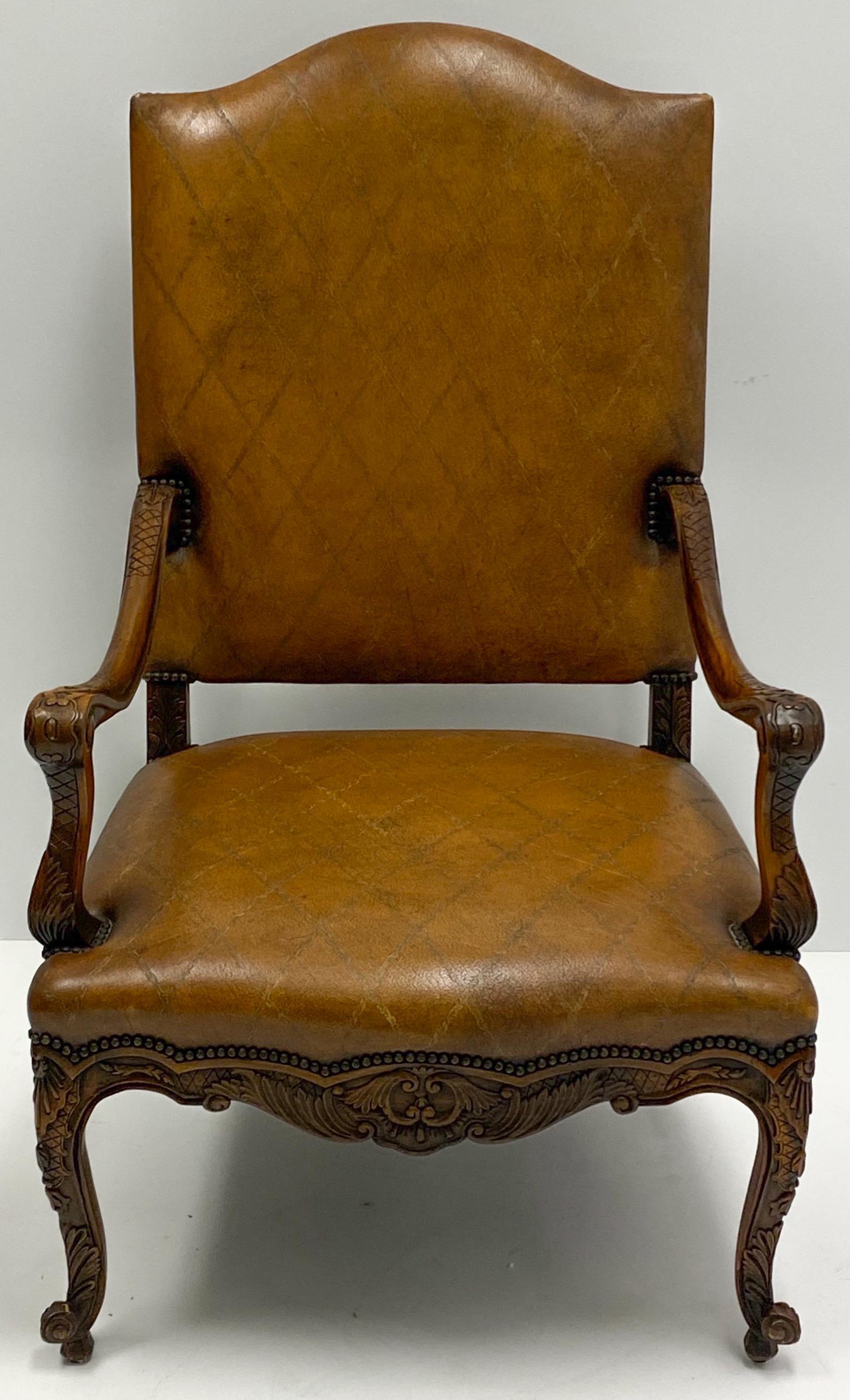 This is a wonderful large scale French styled fruitwood leather bergere chair in very good condition. It most likely dates to the 80s. It is unmarked.
