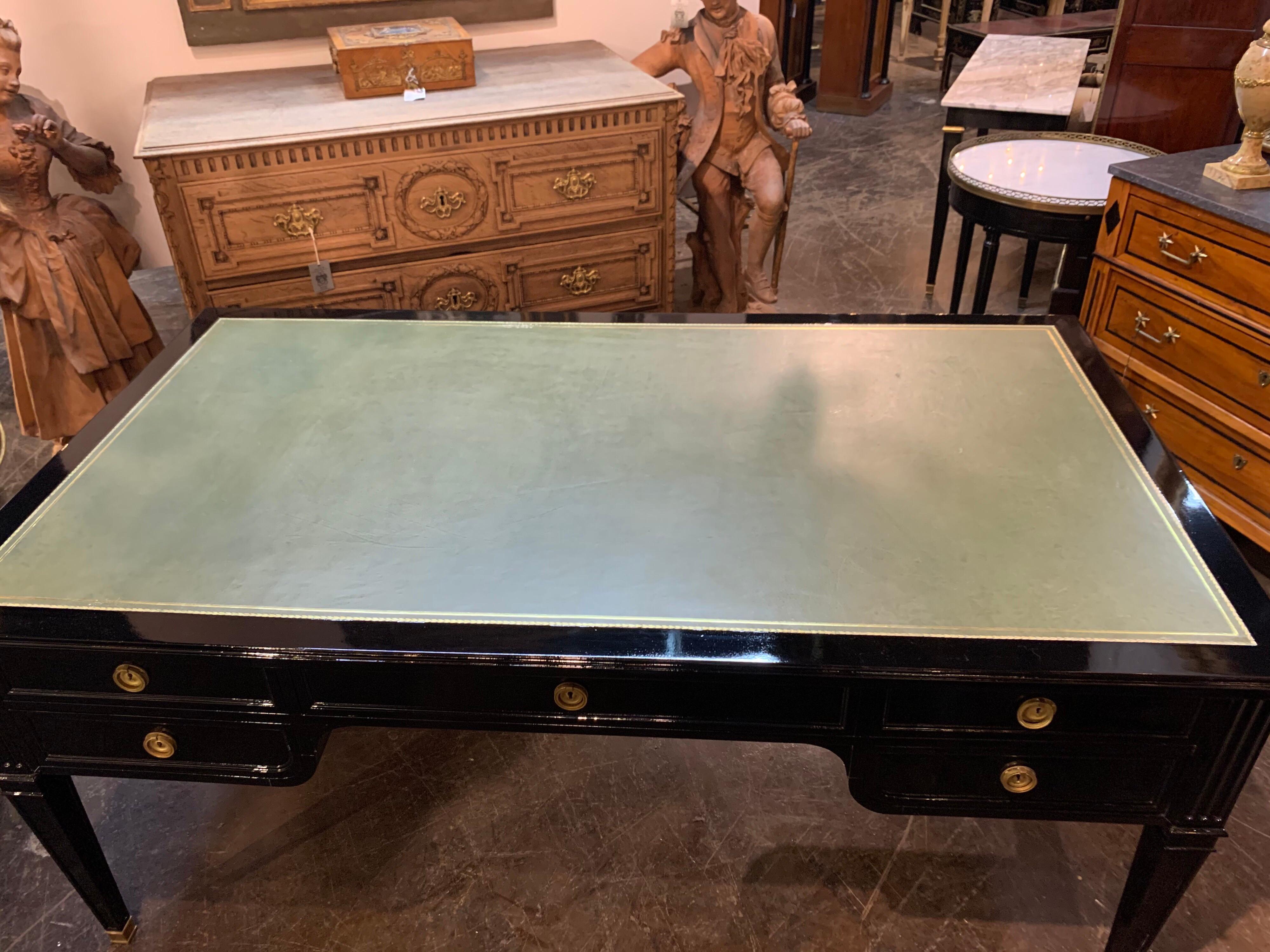 Very fine large scale French Maison Jansen style black lacquered bureau plat desk. Nice green leather on the top of the desk. Beautiful polished look makes an stylish statement. True elegance!