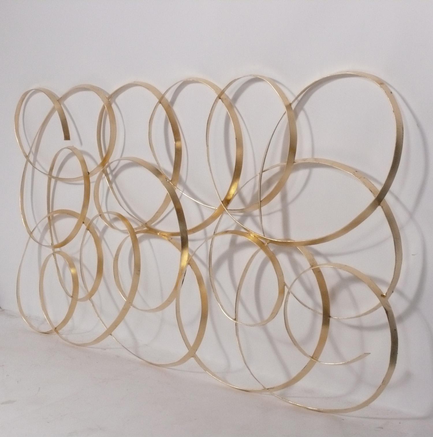 Large scale gilt metal wall sculpture attributed to William Bowie, American, circa 1960s. It measures an impressive 70.75