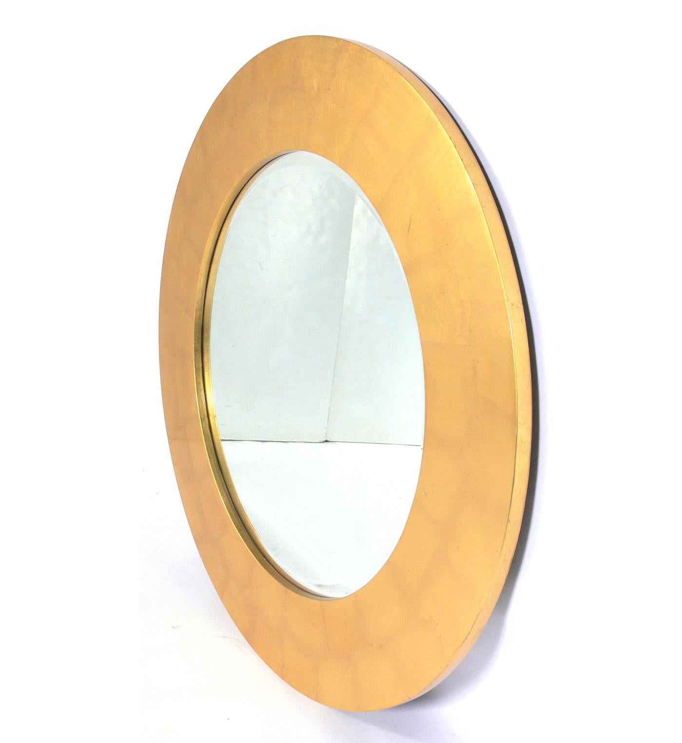 Large scale gold leaf circle mirror, American, circa 1980s. It measures an impressive 48