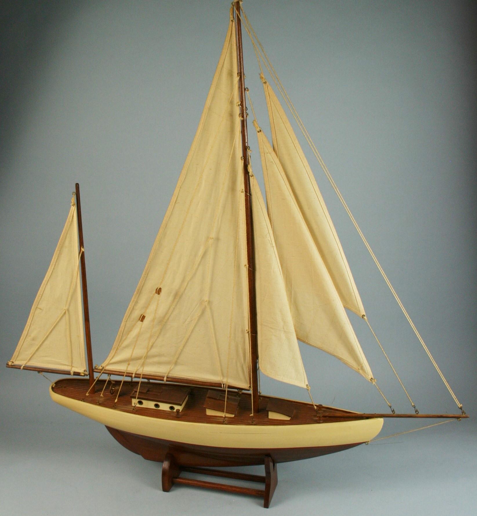 3-569 Hand crafted sail boat model on base.