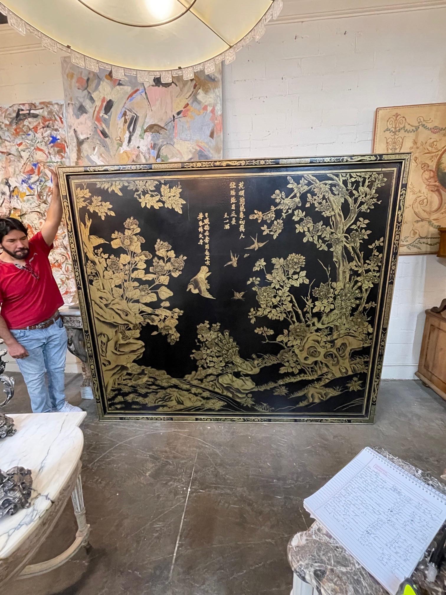 Decorative large scale hand painted Chinoiserie panel in gold and black. Featuring beautiful floral images and birds. A true work of art. Exquisite!