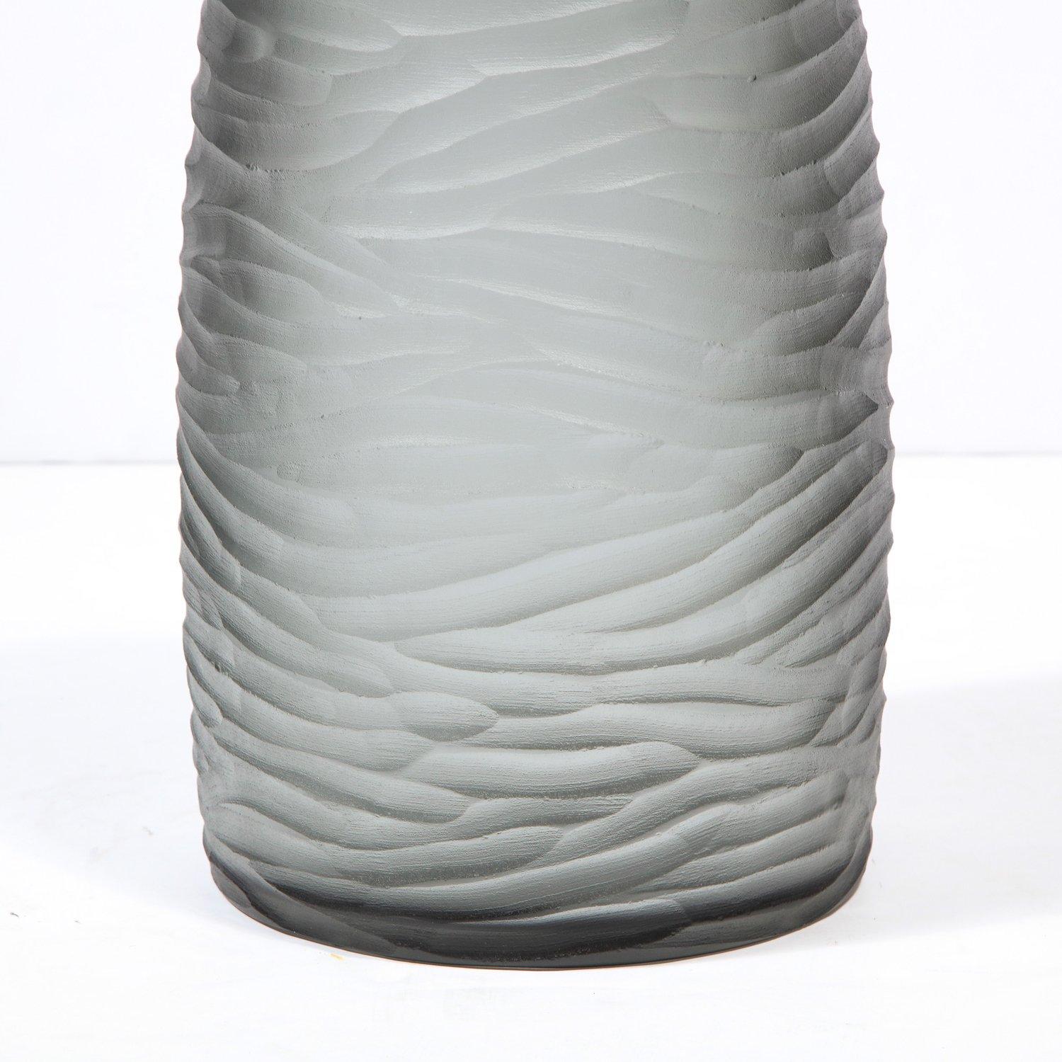 This stunning modernist large vase was handblown in Murano, Italy- the island off the coast of Venice renowned for centuries for its superlative glass production. It features a cylindrical body that tapers subtly at each end in frosted graphite