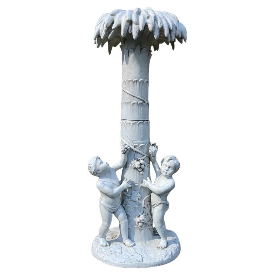 Large Scale Hollywood Regency Era Italian Terracotta Palm Tree Putti Statue For Sale