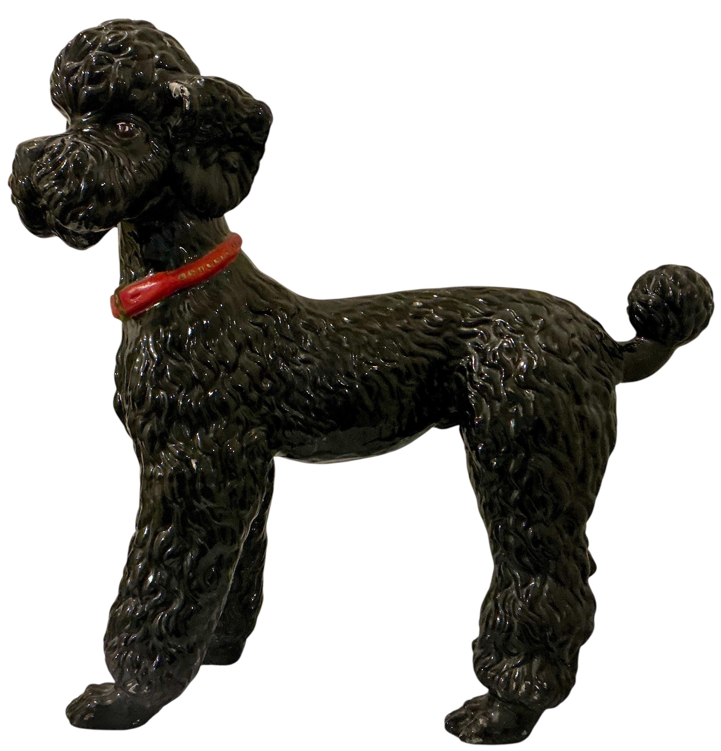 This adorable Hollywood Regency era poodle is Italian and dates to the 60s. He is in very good condition. It is a male and has a sporting or puppy cut. 