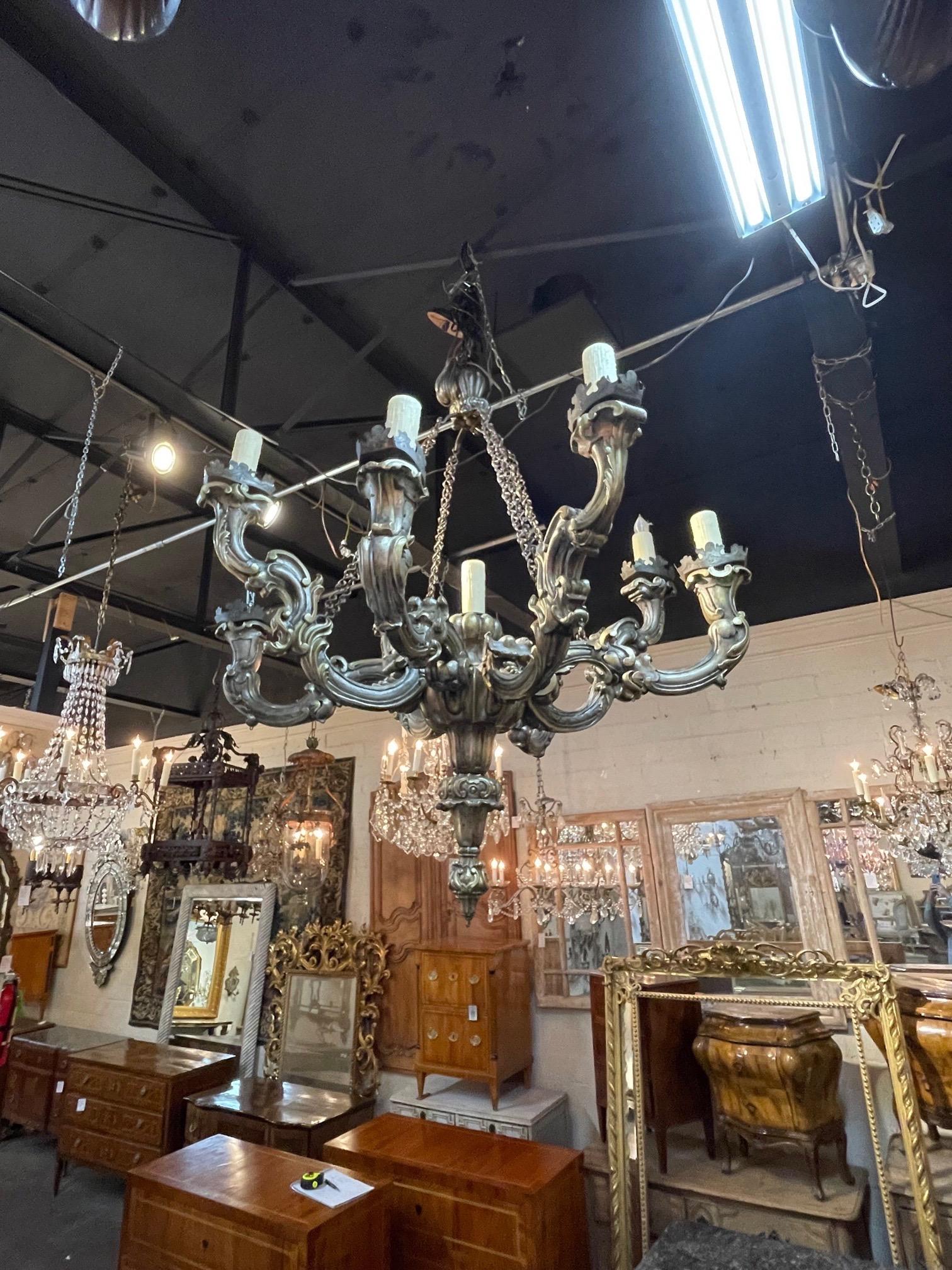 Beautiful antique large scale Italian carved and silver giltwood chandelier with 9 lights. Very nice carving on this piece. Very impressive!!