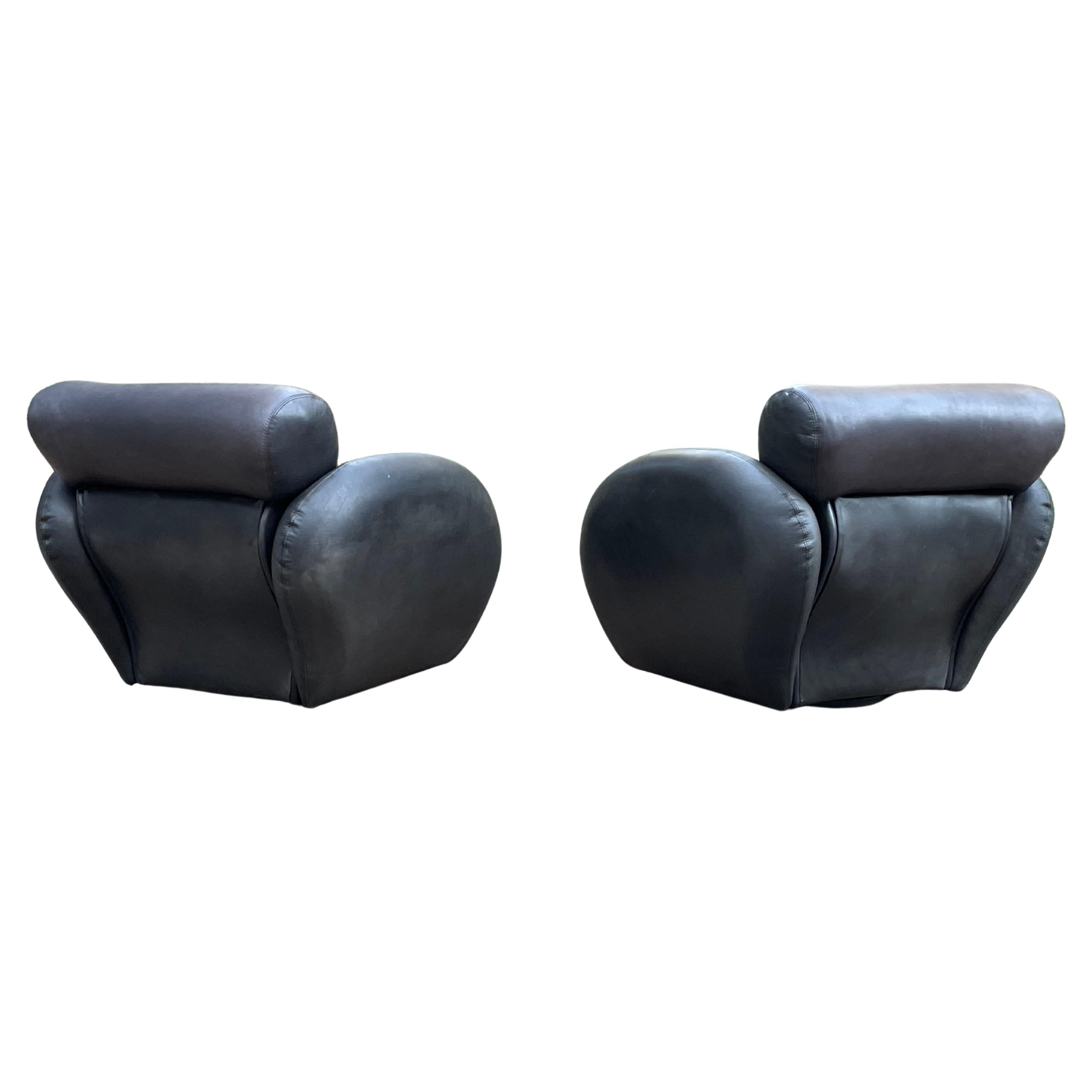Pair of stunning, large scale leather Directional swivel chairs in soft dark grey leather. The lines on these chairs are insane. 

Vladimir Kagan and Milo Baughman both designed legendary chairs in this era for Directional. 

Very rare pair. With