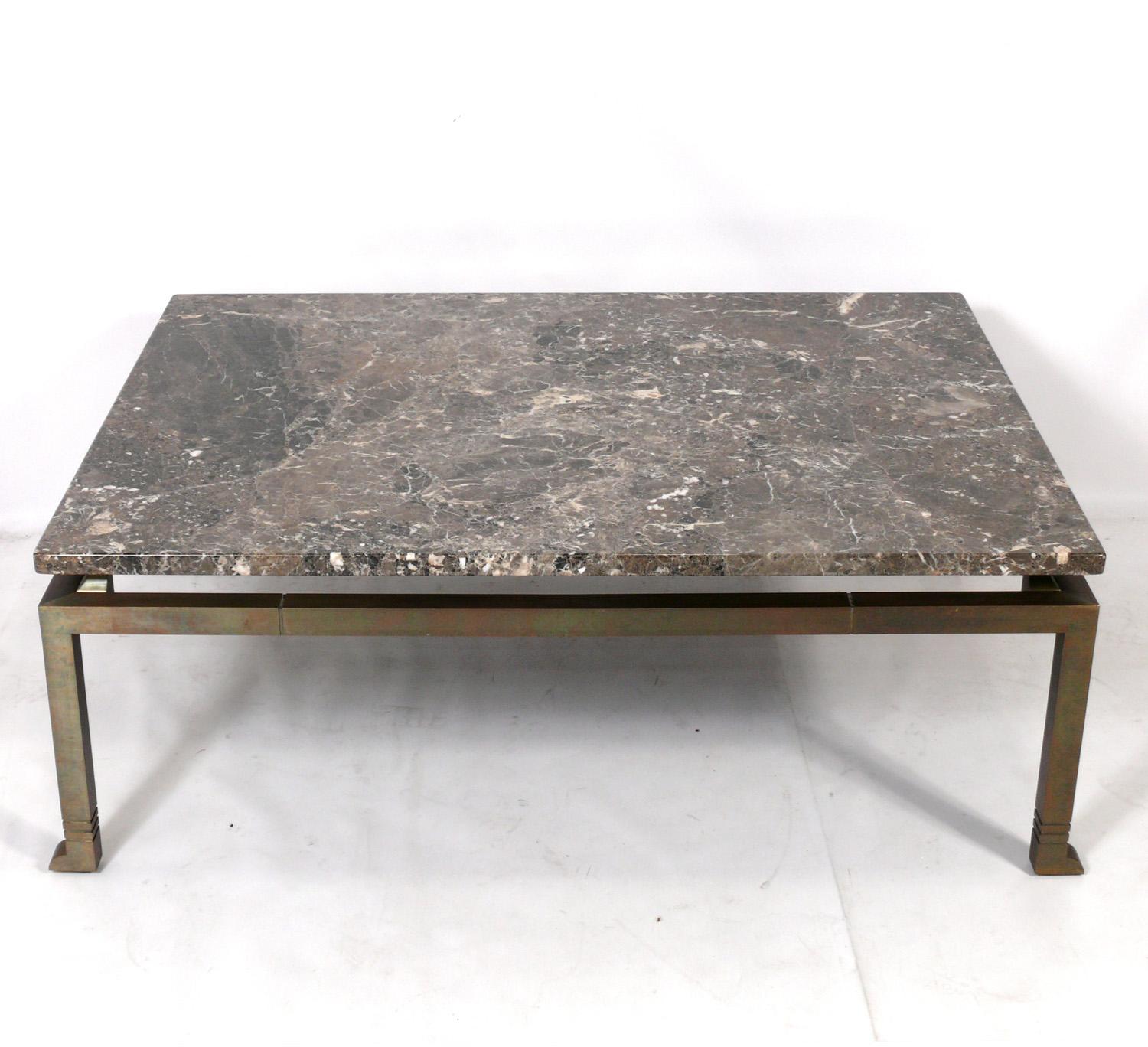 Large scale marble and bronze coffee table, in the manner of Marc du Plantier, France, circa 2000s. Based on a 1930s Art Deco design by Marc du Plantier, this table was constructed in France and retailed through Lorin Marsh in NYC. This custom