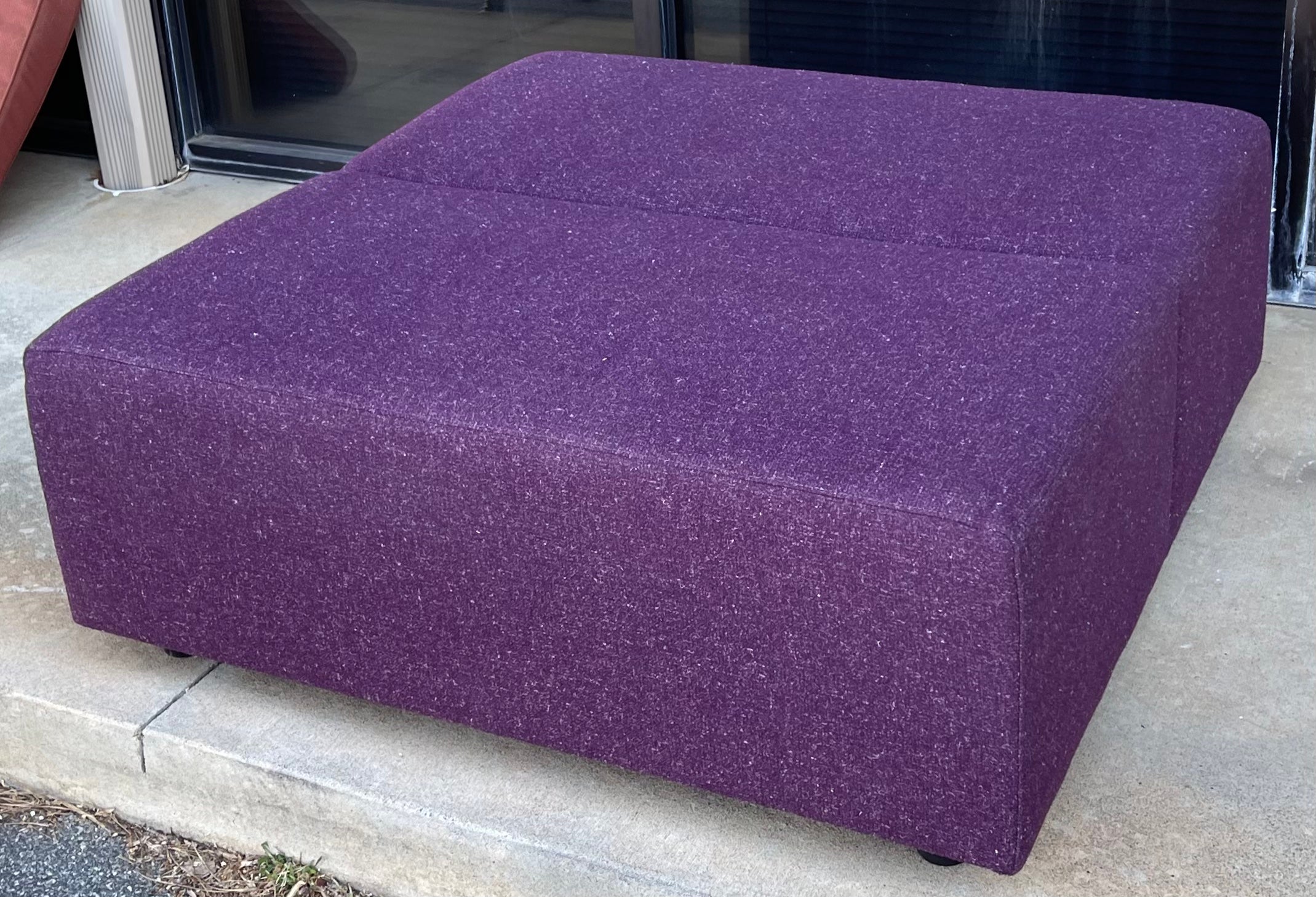 This is a Mid-Century Modern large scale ottoman by the Coalesse division of Steelcase. The fabric is in very good condition, and the piece is marked.