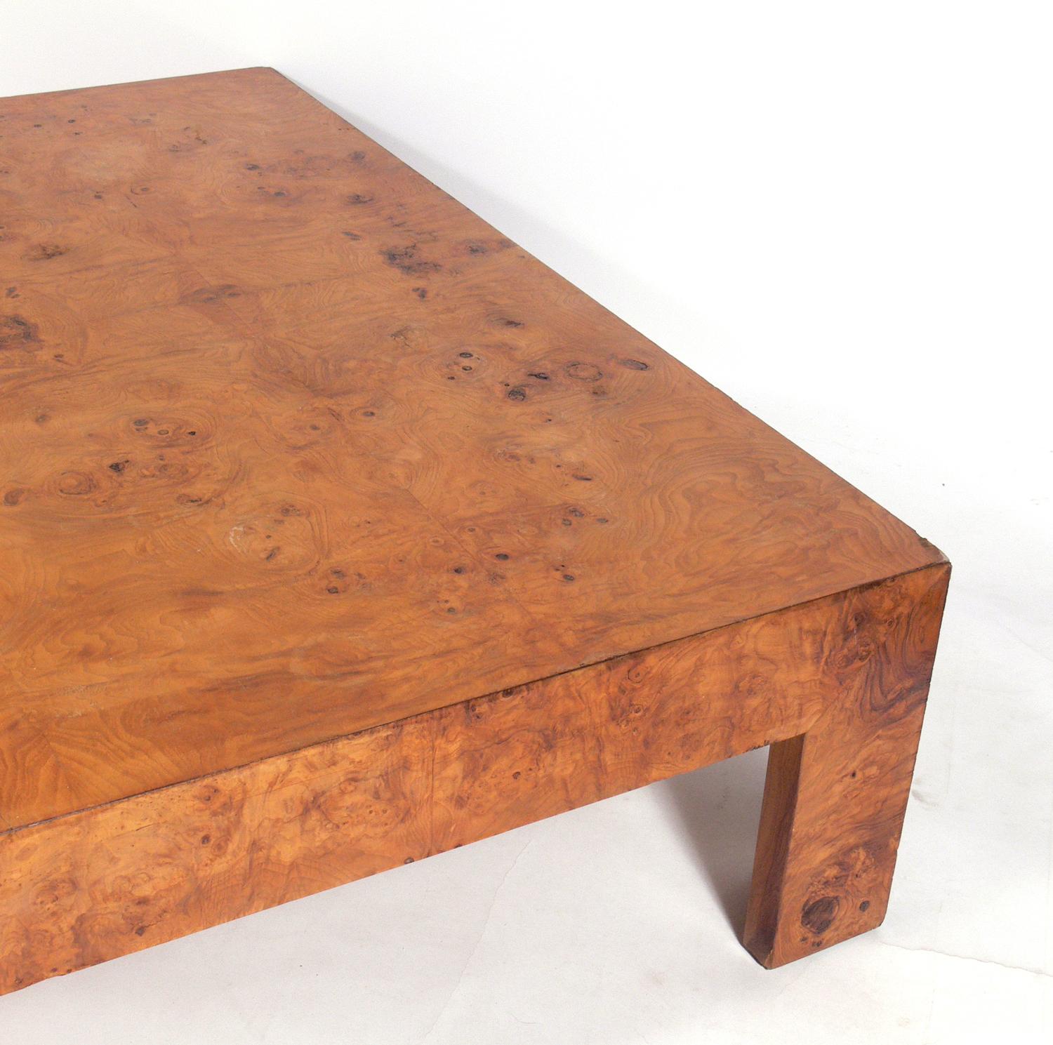 Large-scale burl wood coffee table, designed by Milo Baughman for Thayer Coggin, American, circa 1960s. This large-scale table was made for entertaining and the burled wood graining is beautiful. It is currently being refinished and can be completed