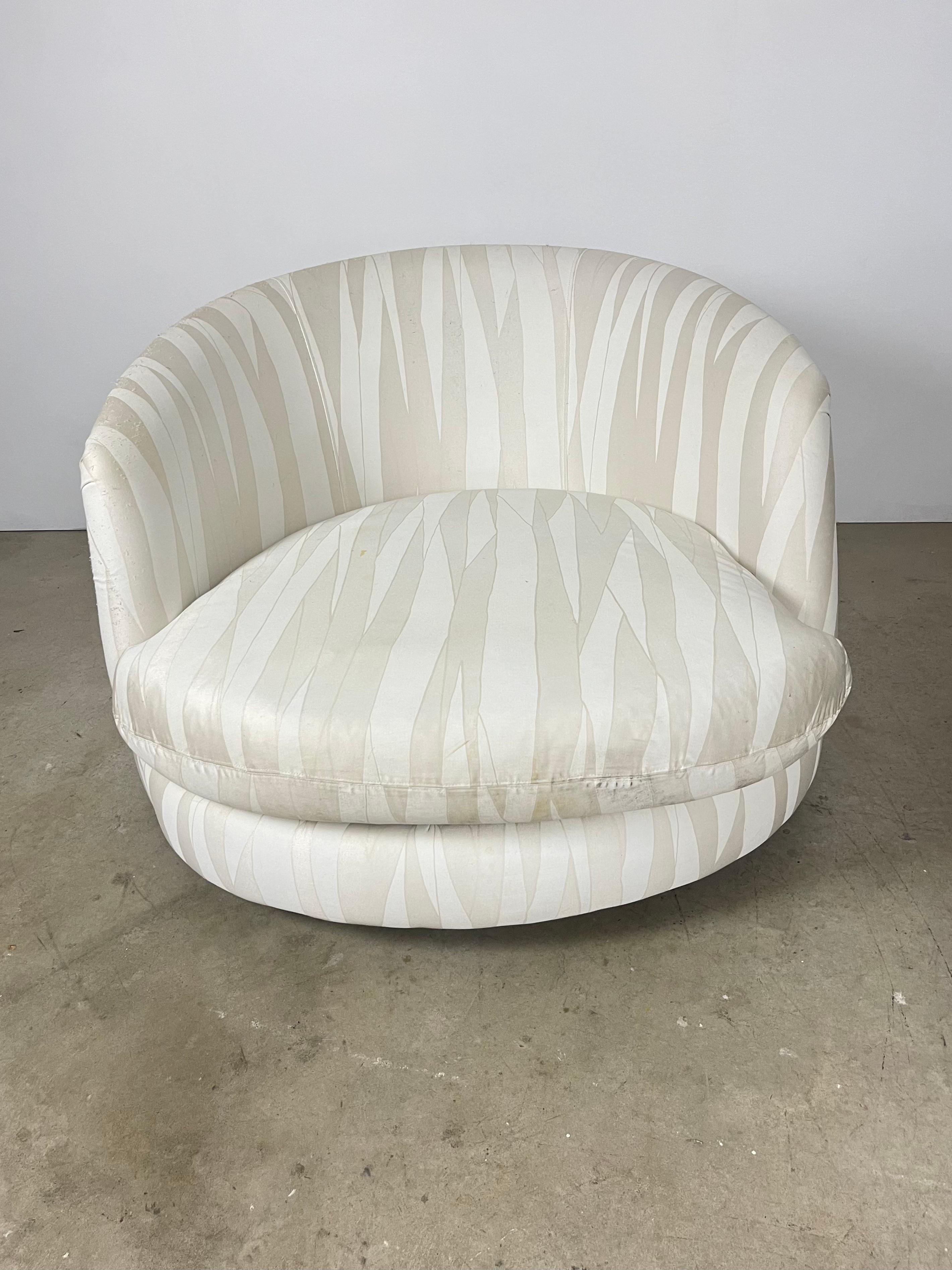 Oversized large scale swivel chair designed by Milo Baughman for Thayer Coggin. Original upholstery is present, recommended to be replaced. Chrome base is present. Piece retains original Thayer Coggin tags. Wear to the upholstery, pilling on the