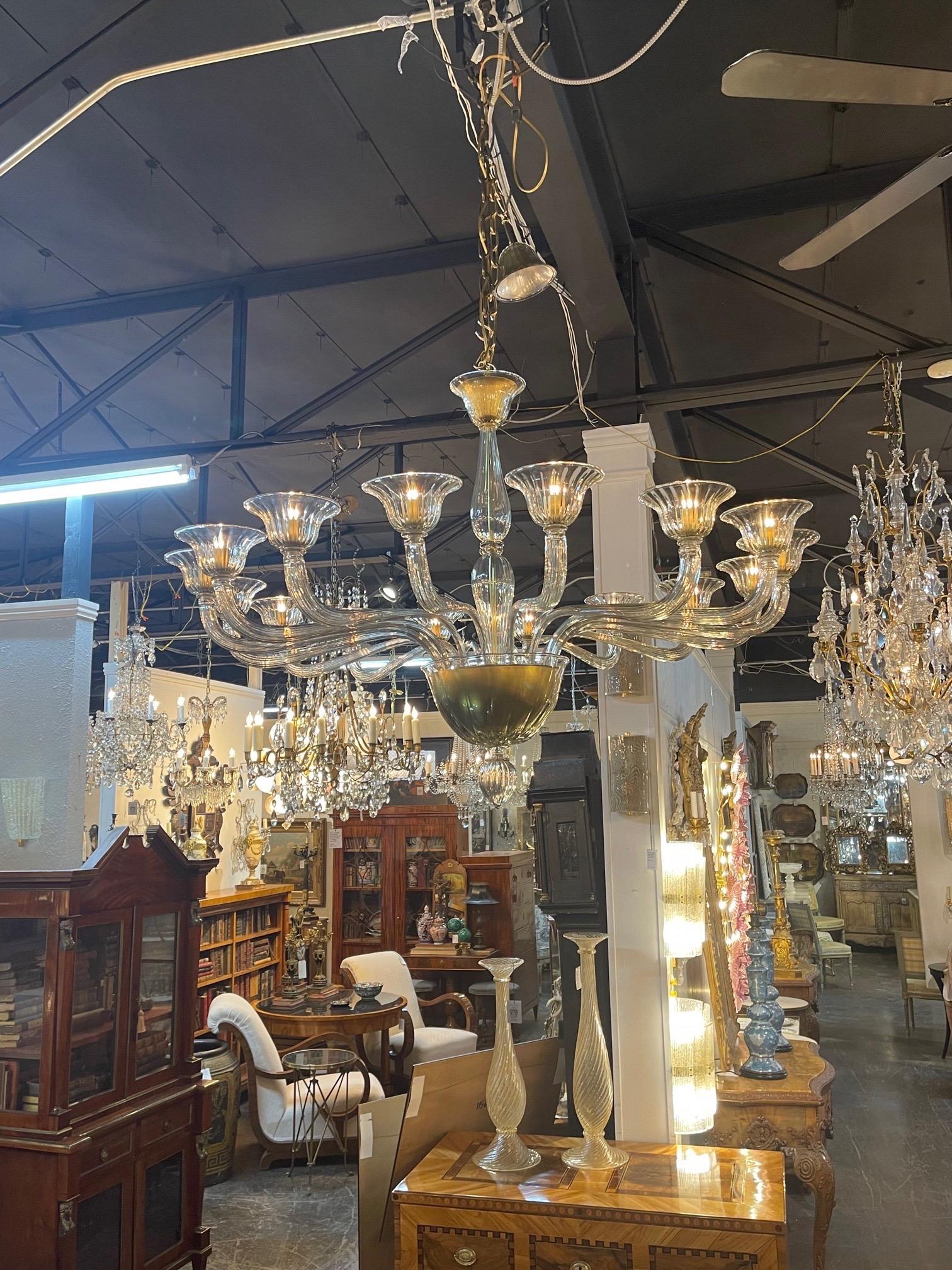 Spectacular large scale modern Murano glass chandelier with 16 lights. Pretty pale gold color with beautiful decorative arms. A true work of art that is sure to impress!!