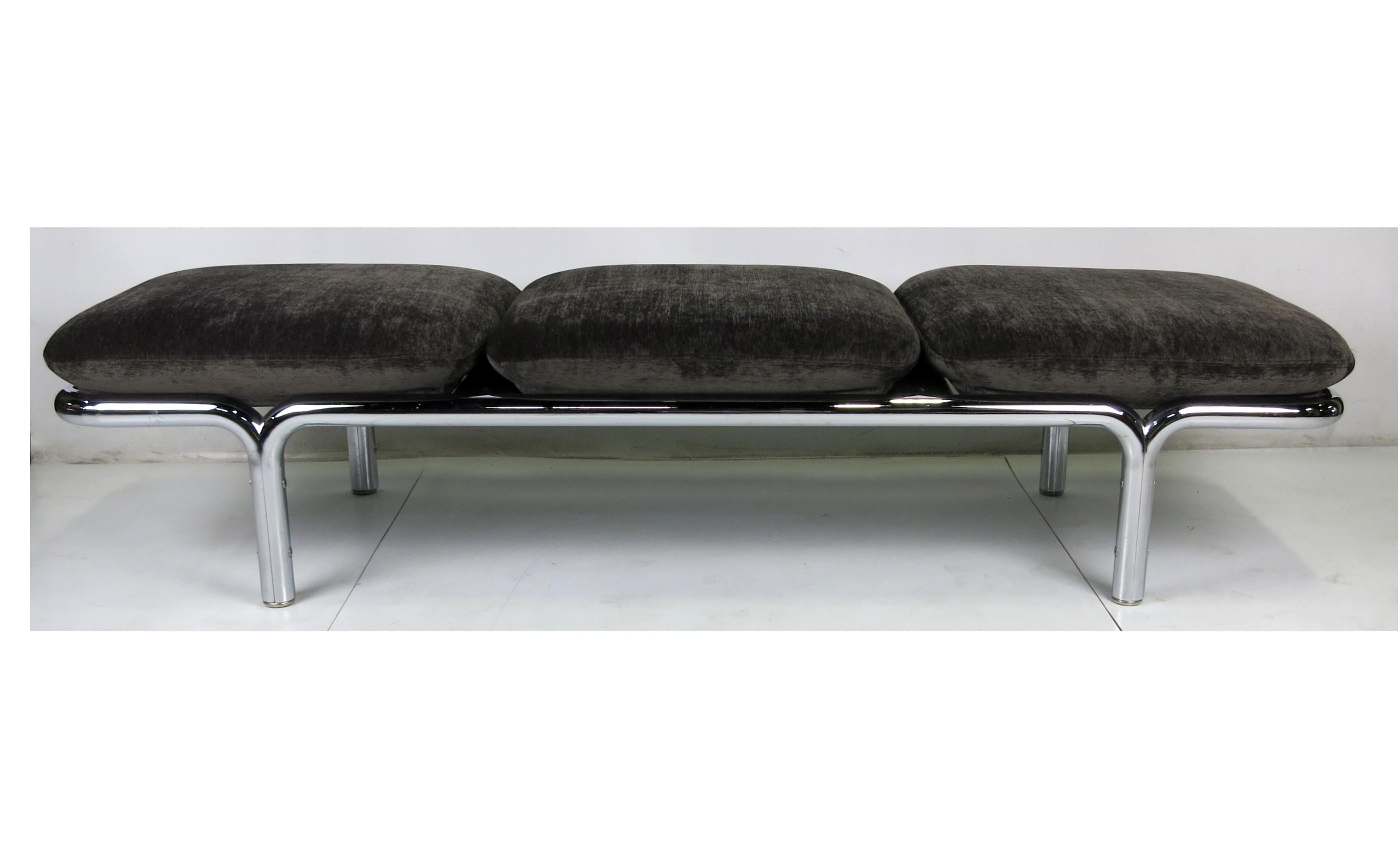Large-scale chrome gallery bench with three well padded cushions, freshly upholstered in charcoal grey chenille.
