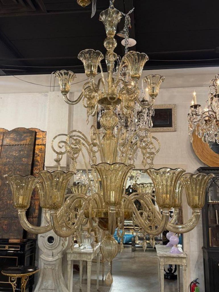 The large scale Murano glass chandelier is a modern and stylish lighting fixture designed for luxury homes and spaces. Featuring a multi-tiered arms with glistening glass, this chandelier brings a touch of elegance and sophistication to any room.