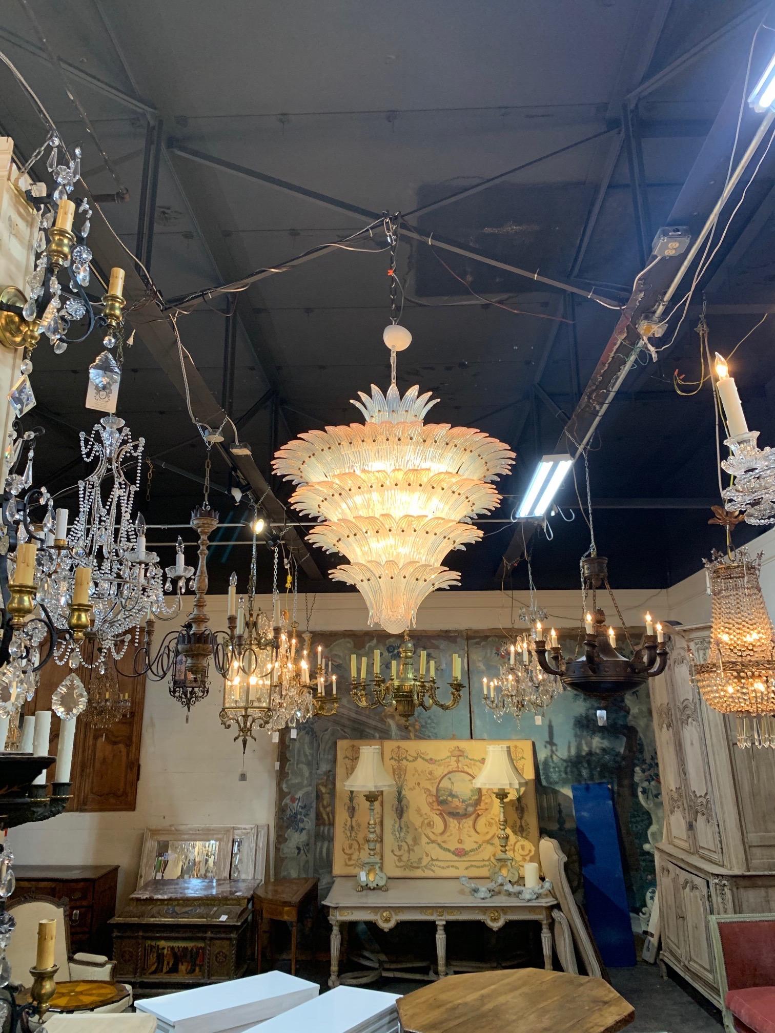 Exquisite large scale Murano glass chandelier. Layers beautiful leaf shaped glass absolutely glistens. This fixture is so impressive and is a true work of art!