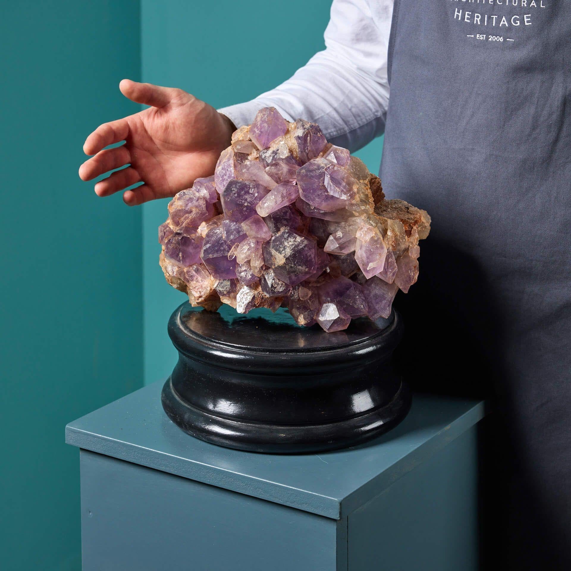A large scale natural amethyst specimen originating from Brazil. Crystals from Brazil are most often found as radiating masses, with individual crystals appearing as pyramids, such as this one.

This exceptional mineral has a striking form that has
