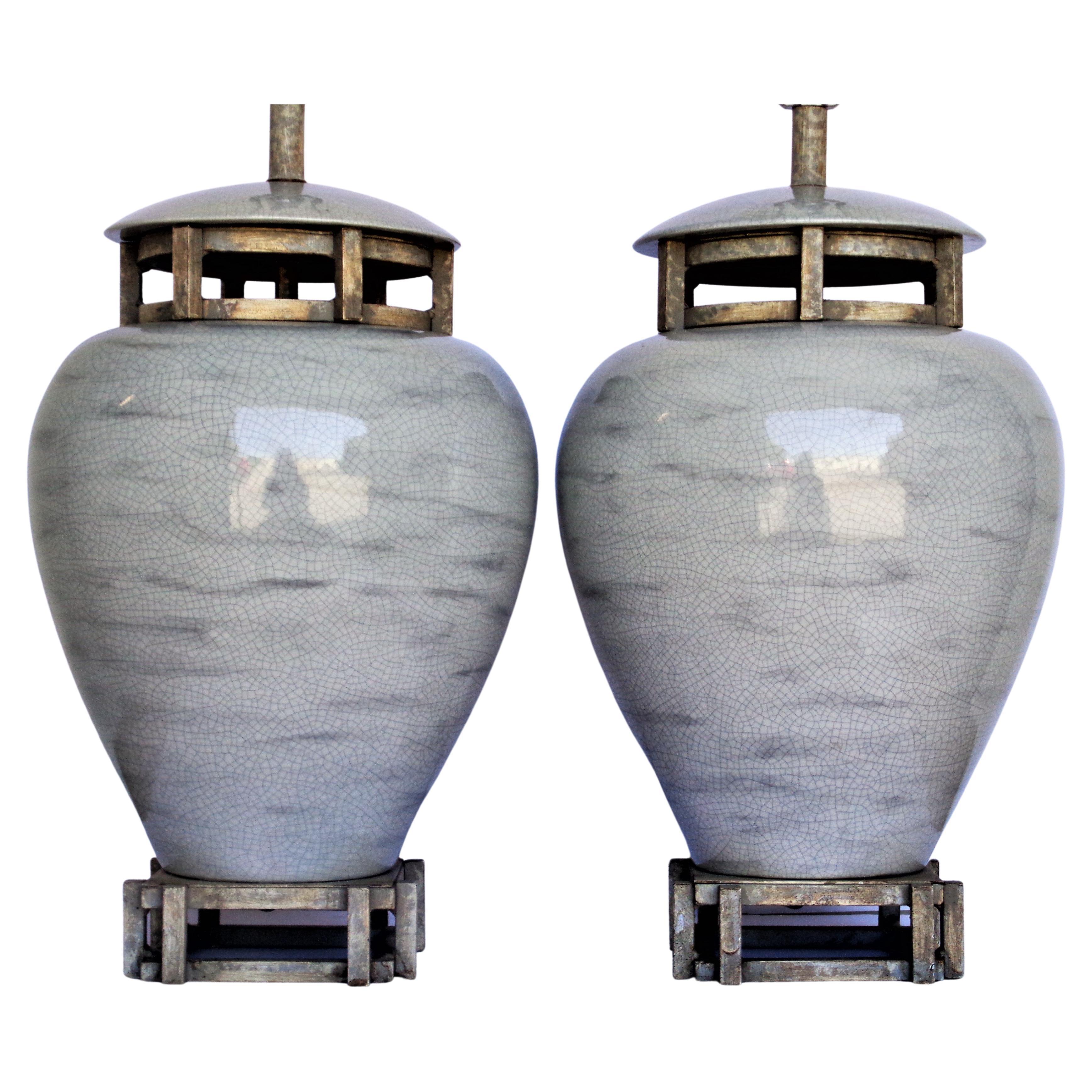  Pair of large scale neoclassical modern crackle glazed porcelain ceramic table lamps with attached architectural silver leaf wood bases and inset tops. Great quality. Circa 1970's. Look at all pictures and read condition report in comment section.